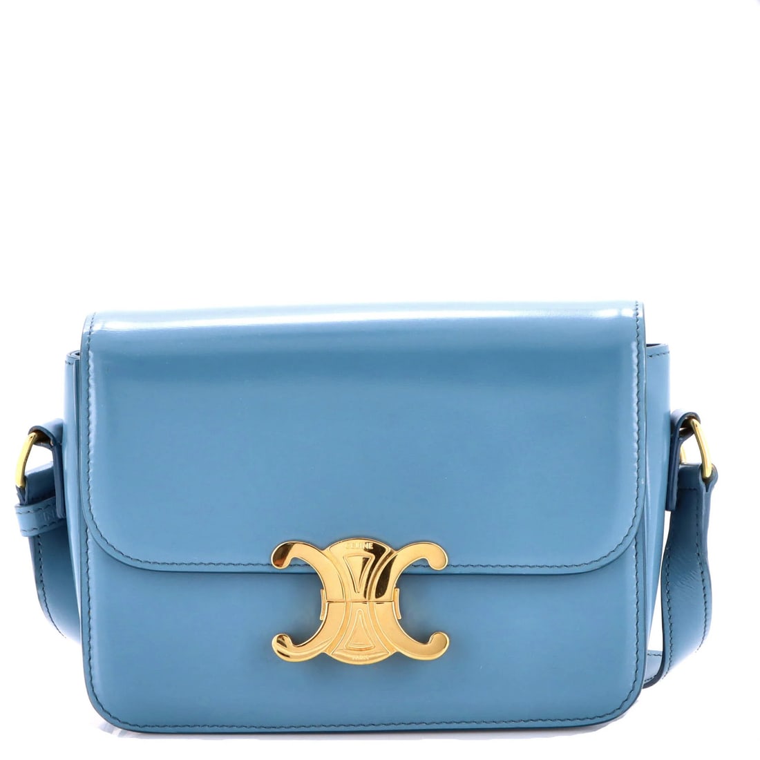 Shoulder bag calfskin smooth triomphe teen: Shoulder bag calfskin smooth triomphe teen The Celine Triomphe Shoulder Bag Smooth Calfskin Teen in blue leather features a sleek cross body design with minor scuffs on the exterior and creases on the
