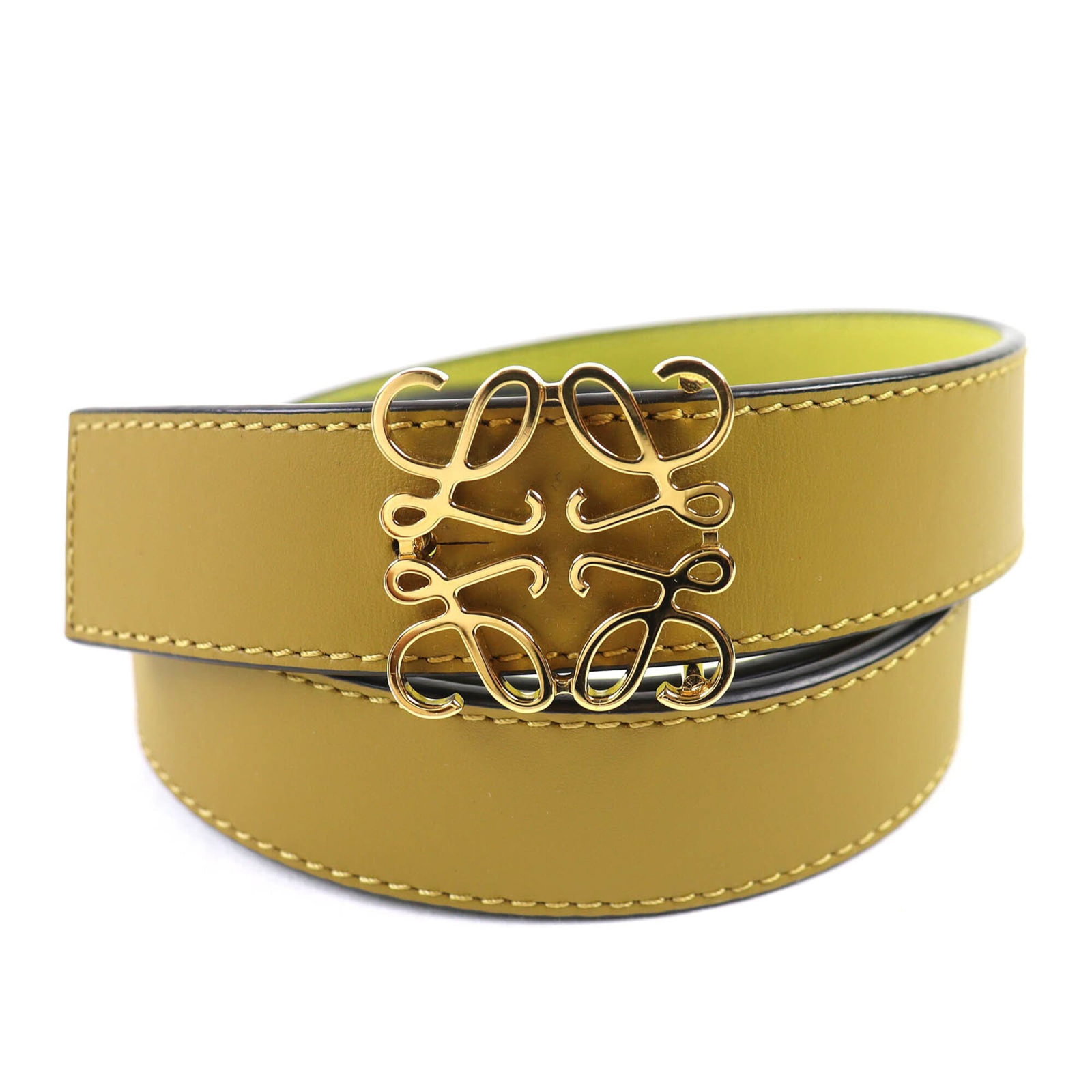 Standard Belt By Loewe: Standard Belt By Loewe Standard Belt By Loewe is crafted from high-quality leather, available in three distinct colors: green, olive, and yellow. Measuring 75cm to 84.5cm in length, the belt features 