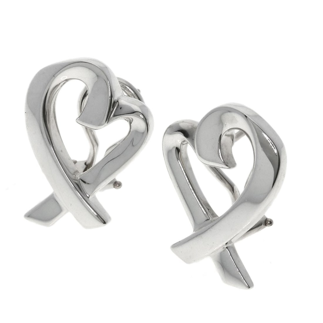 Loving heart earring silver from Tiffany Co.: Loving heart earring silver from Tiffany Co. Silver Loving Heart Earrings from Tiffany Co. are a classic design featuring a simple yet elegant heart shape made from sterling silver. With no stone