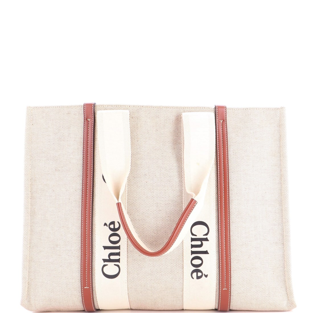 Chloe Woody Tote Canvas with Leather Large: Chloe Woody Tote Canvas with Leather Large Brown canvas tote with leather accents, featuring a neutral interior and classic design. The large size measures 17" wide, 12.5" tall, and has a 9" handle