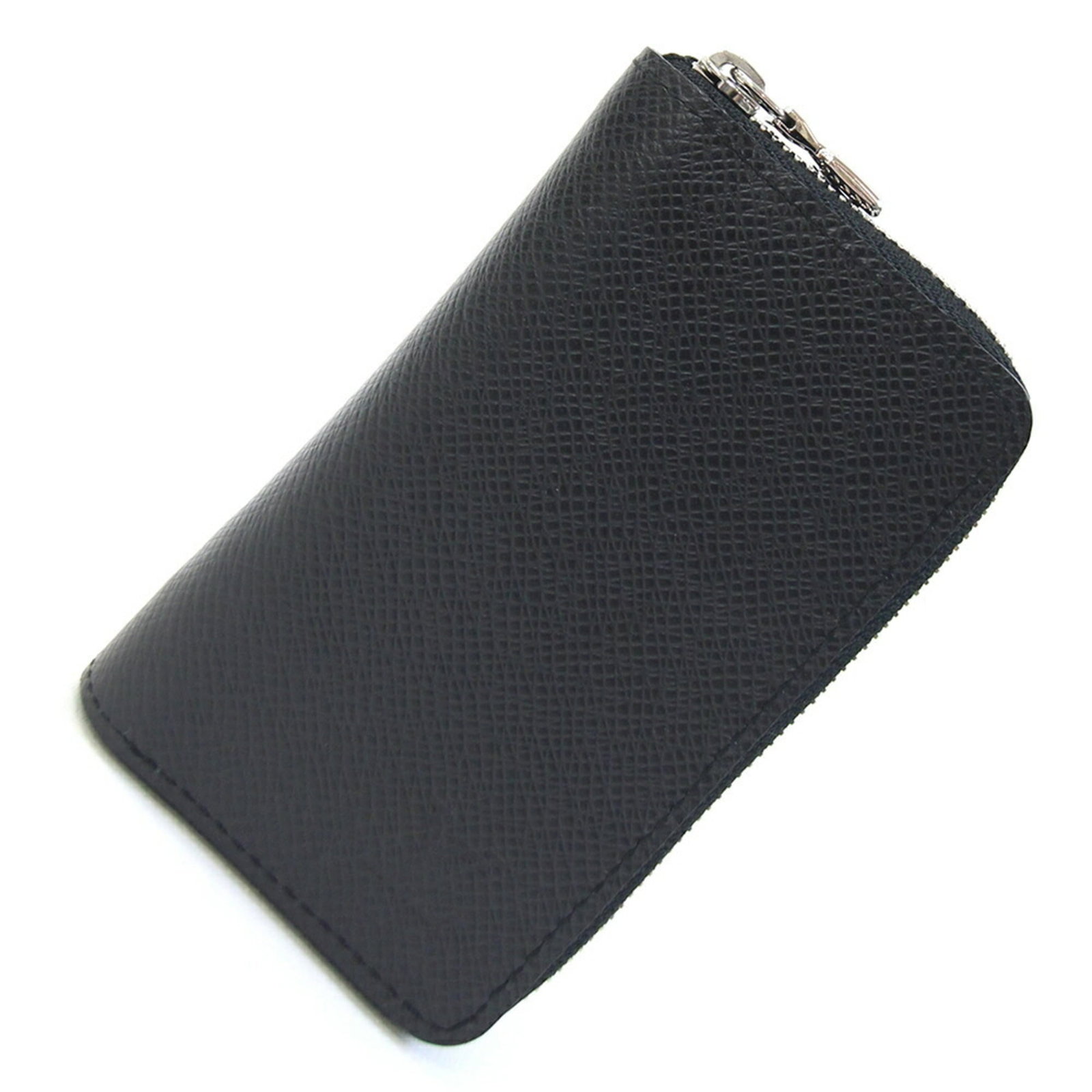 Louis Vuitton Taiga Leather Coin Case: Louis Vuitton Taiga Leather Coin Case Taiga leather craftsmanship shines in this sleek Louis Vuitton coin case, featuring black Noir finish and precise dimensions. Made from high-quality Taiga
