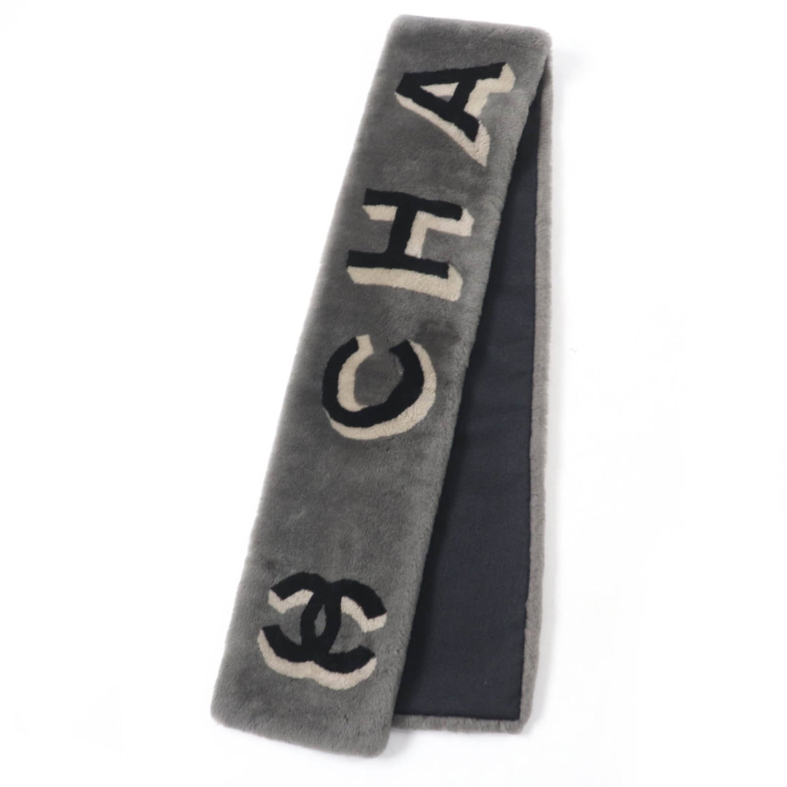 Stole Leather Cashmere By Chanel: Stole Leather Cashmere By Chanel Stole Leather Cashmere By Chanel - A Luxurious Gray Mouton Stole. This stunning stole features a rich gray color and luxurious materials, combining leather and cashmer