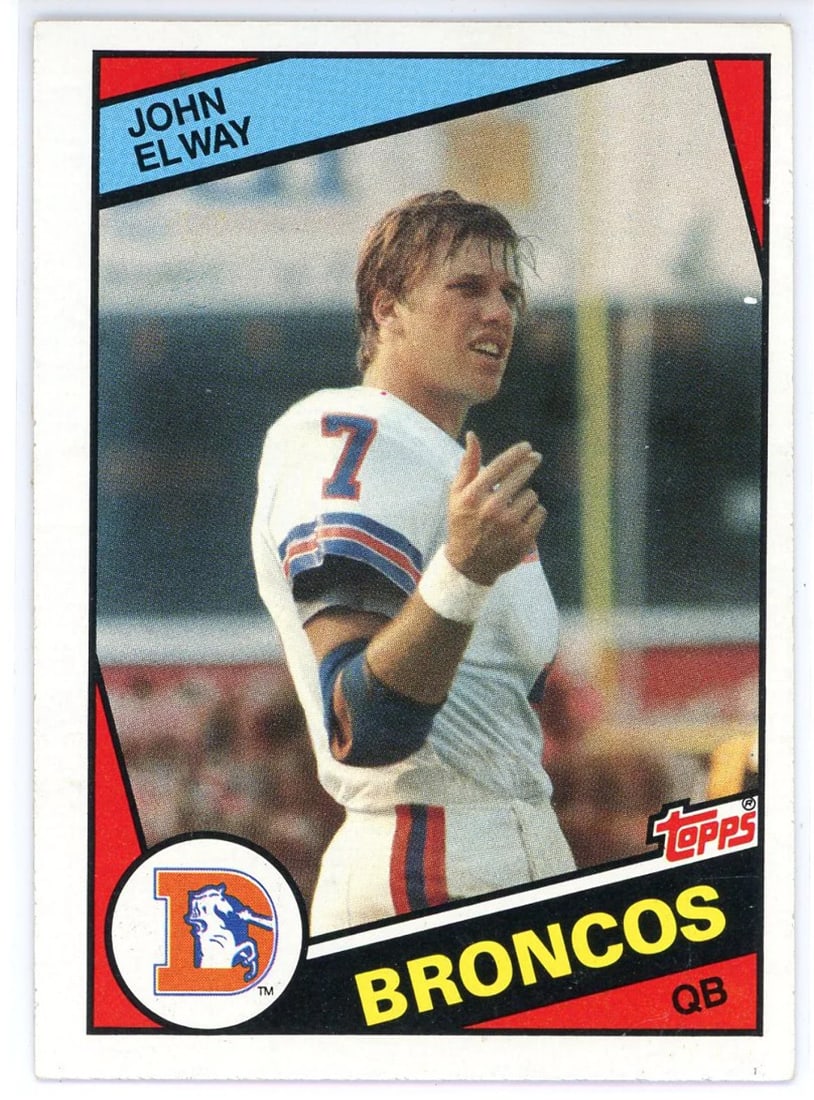 Elway John 1984 Topps Rookie Card: Elway John 1984 Topps Rookie Card Topps John Elway 1984 Topps Rookie Card #63. This card features the iconic rookie card of NFL legend John Elway, numbered #63 in the 1984 Topps set. A piece of sports