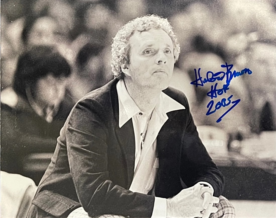 Brown Hubie Autographed Basketball Photo: Brown Hubie Autographed Basketball Photo Hubie Brown's 8x10 basketball photo, signed across the front in blue sharpie with the inscription "HOF 2005". This unique piece features a notable figure from 