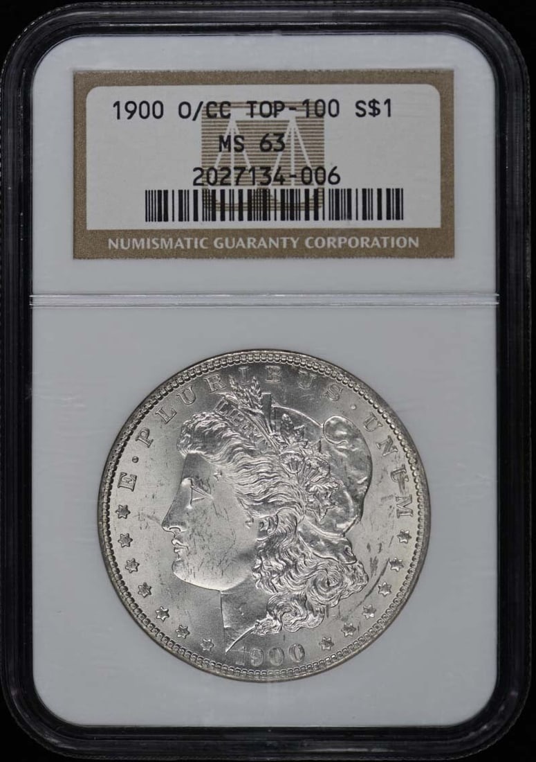 1900-O/ CC TOP-100 Morgan Dollar S$1 NGC MS63: 1900-O/ CC TOP-100 Morgan Dollar S$1 NGC MS63 The 1900-O/ CC TOP-100 Morgan Dollar S$1 NGC MS63 is an uncirculated coin with a high grade of MS63, indicating excellent condition. Certified by the Numi
