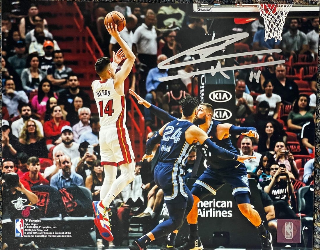 Autographed shooting basketball photo by Tyler Herro 8x10: Autographed shooting basketball photo by Tyler Herro 8x10 Tyler Herro's sharpie signature adds a touch of personal flair to this 8x10 shooting basketball photo, making it a unique piece for fans. The 