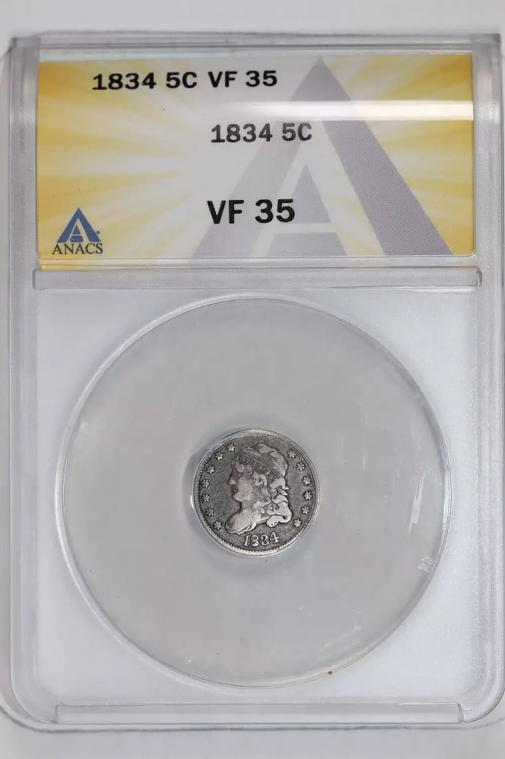 1834 CAPPED BUST HALF DIME ANACS VF35: 1834 CAPPED BUST HALF DIME ANACS VF35 The 1834 Capped Bust Half Dime features an iconic design with its Capped Bust obverse and Barque ship reverse. This circulated coin has been certified by ANACS