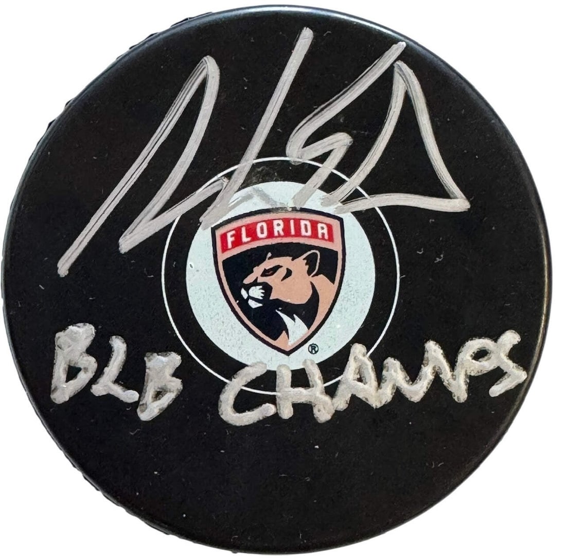 Aaron Ekblad Autographed Official Florida Panthers Puck (Beckett Witness): Aaron Ekblad Autographed Official Florida Panthers Puck (Beckett Witness) Aaron Ekblad's silver paint pen signature on the front of this official Florida Panthers puck, along with the inscription "B2B