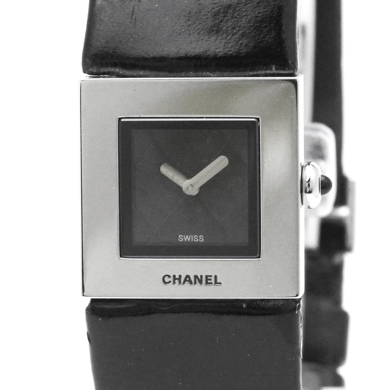Wristwatch by Chanel: Wristwatch by Chanel Stainless steel case and leather band make for a sleek, formal look. The black dial features a quartz movement, keeping time with precision. Weighing in at just 20g, this Chanel w