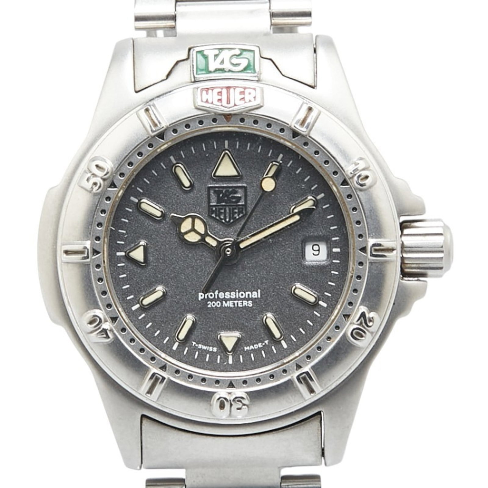 Tag Heuer Wristwatch: Tag Heuer Wristwatch Stainless steel case and band, the Tag Heuer WF1411-0 wristwatch boasts a sleek gray finish. Water-resistant up to 200m, this quartz watch features an analog display with date and