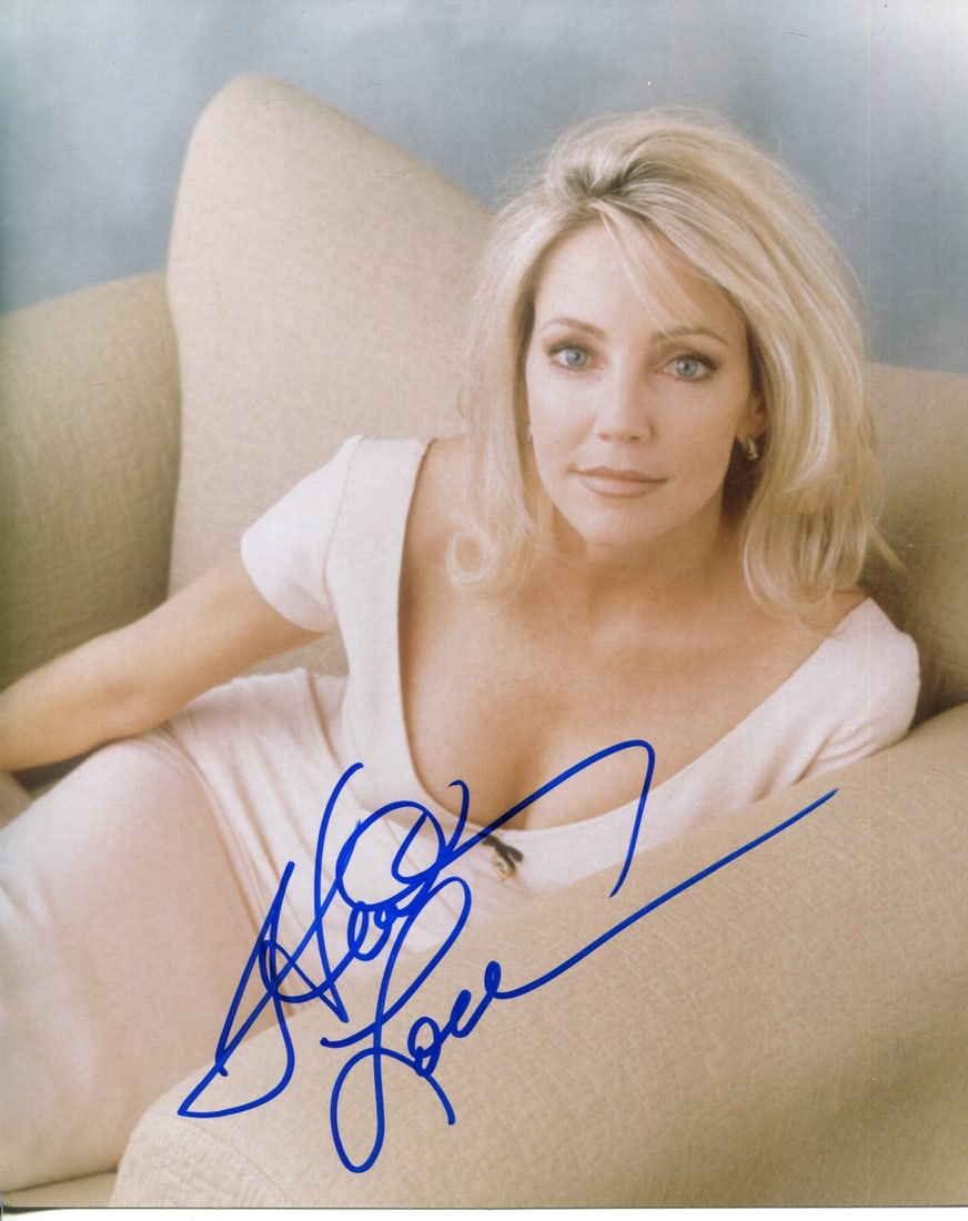 Locklear Heather Autographed Photo 8x10: Locklear Heather Autographed Photo 8x10 Heather Locklear's 8x10 photo bears her signature in blue sharpie across the front, a unique and personal touch for fans and collectors. This autographed photo 