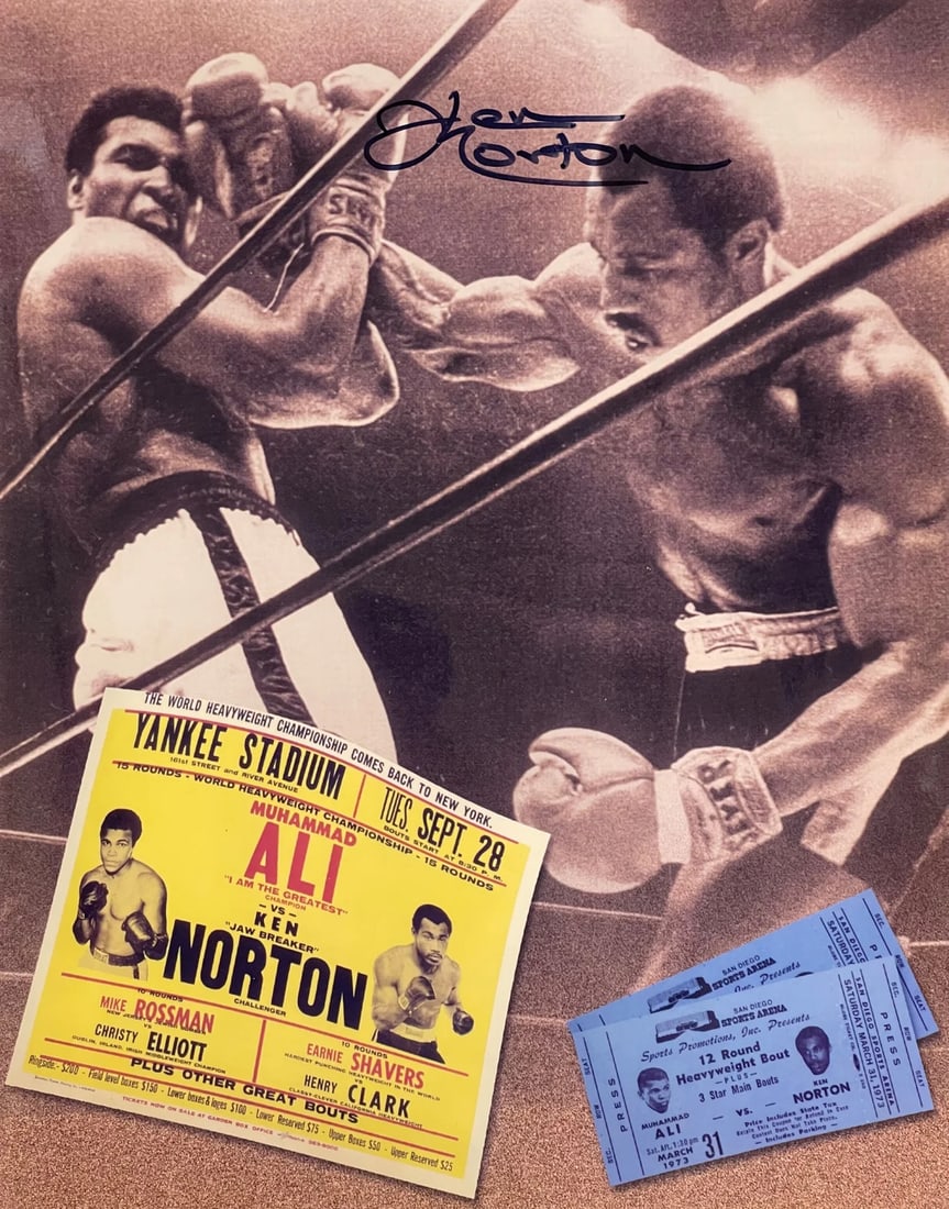 Norton Ken Autographed Photo Boxing 11x14 vs Ali: Norton Ken Autographed Photo Boxing 11x14 vs Ali Ken Norton's iconic boxing photo against Muhammad Ali, signed in blue sharpie across the front. This 11x14 inch image captures a pivotal moment in spor