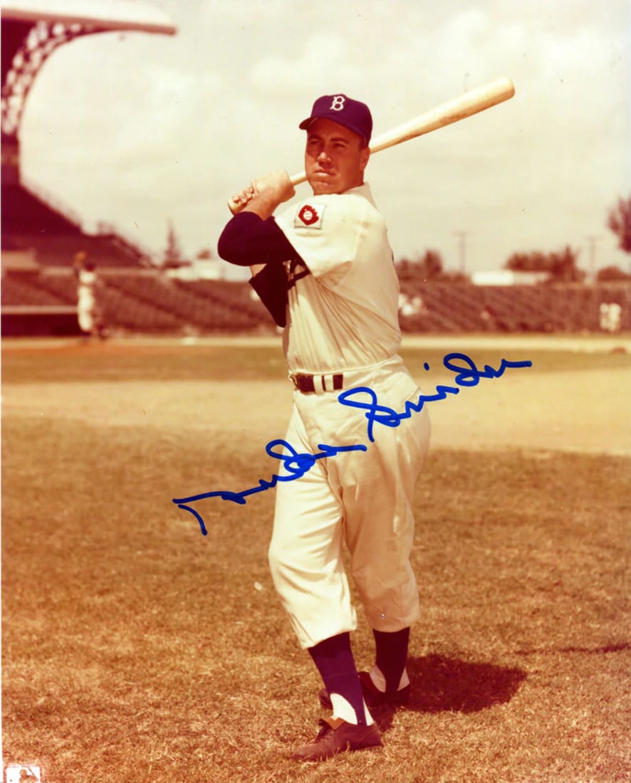 DUKE SNIDER AUTOGRAPHED BAT PHOTO: DUKE SNIDER AUTOGRAPHED BAT PHOTO Duke Snider's 8x10 bat photo bears his signature in blue ink, a rare and unique piece for baseball enthusiasts. The item comes with a Certificate of Authenticity (HWC