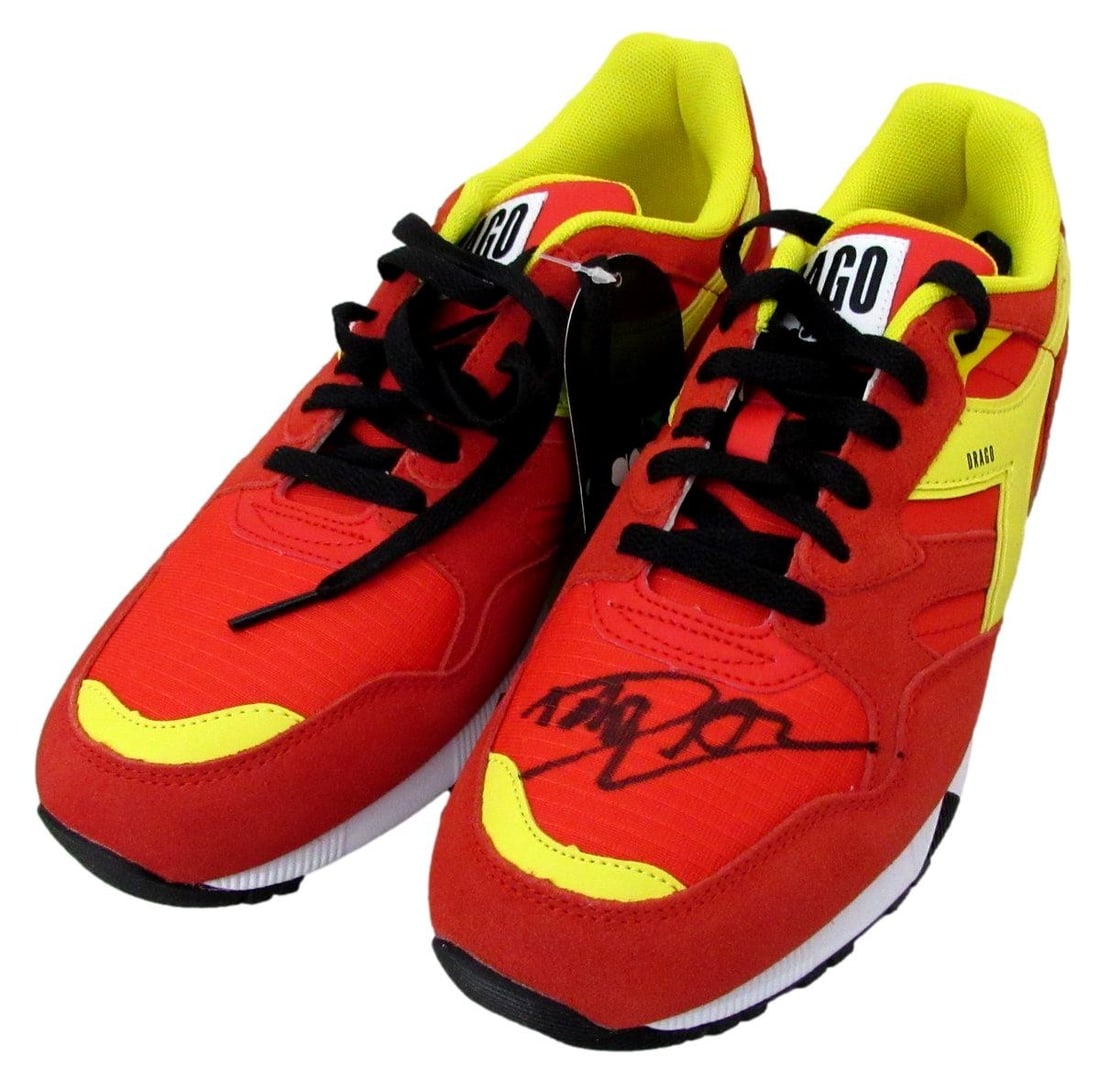 Dolph Lundgren Signed/ Auto Pair of Rocky/ Drago Sneakers Size 9 PSA/ DNA 198692: Dolph Lundgren Signed/ Auto Pair of Rocky/ Drago Sneakers Size 9 PSA/ DNA 198692 Signed by Dolph Lundgren, these iconic sneakers from the Rocky and Drago franchises are a must-have for fans. The auto 