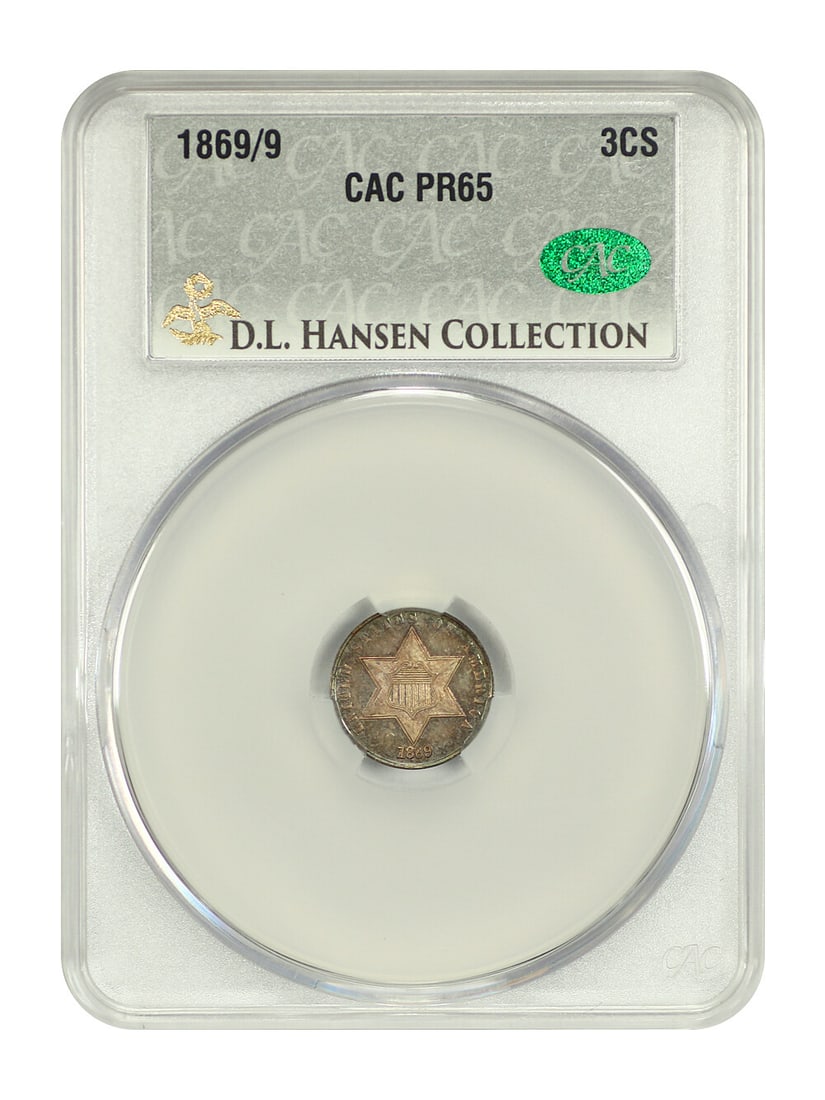 1869/ 9 3CS CACG PR65 ex: D.L. Hansen - Three Cent Silver: 1869/ 9 3CS CACG PR65 ex: D.L. Hansen - Three Cent Silver The Three Cent Silver coin, minted in Philadelphia in 1869, boasts a striking PR65 grade, indicating exceptional condition. This circulated/un