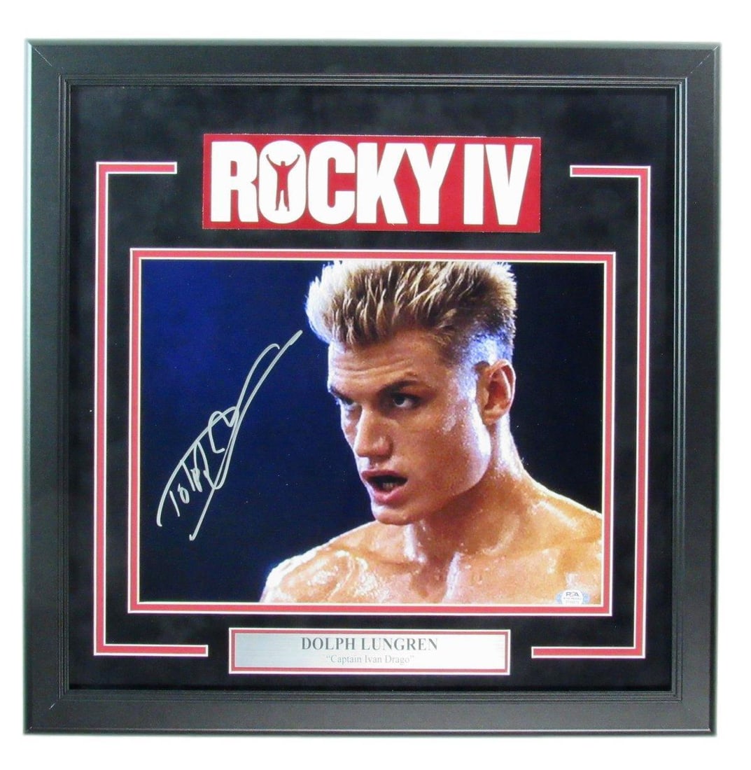 Dolph Lundgren Autographed 11x14 Photo Rocky IV Ivan Drago Framed PSA/ DNA 181156: Dolph Lundgren Autographed 11x14 Photo Rocky IV Ivan Drago Framed PSA/ DNA 181156 Authentic Dolph Lundgren Autographed 11x14 Photo Rocky IV Ivan Drago Framed by PSA/DNA, featuring the iconic boxer's s