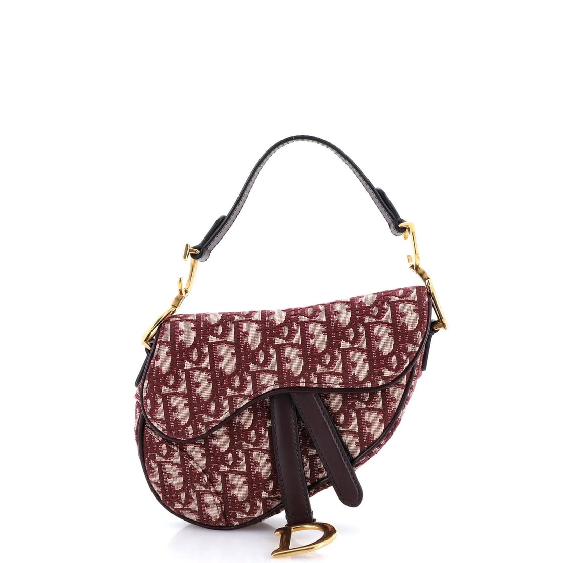 Canvas mini handbag saddle Oblique Christian Dior: Canvas mini handbag saddle Oblique Christian Dior Canvas mini handbag saddle Oblique Christian Dior features a striking red canvas exterior with neutral interior and aged gold hardware. The bag's obli