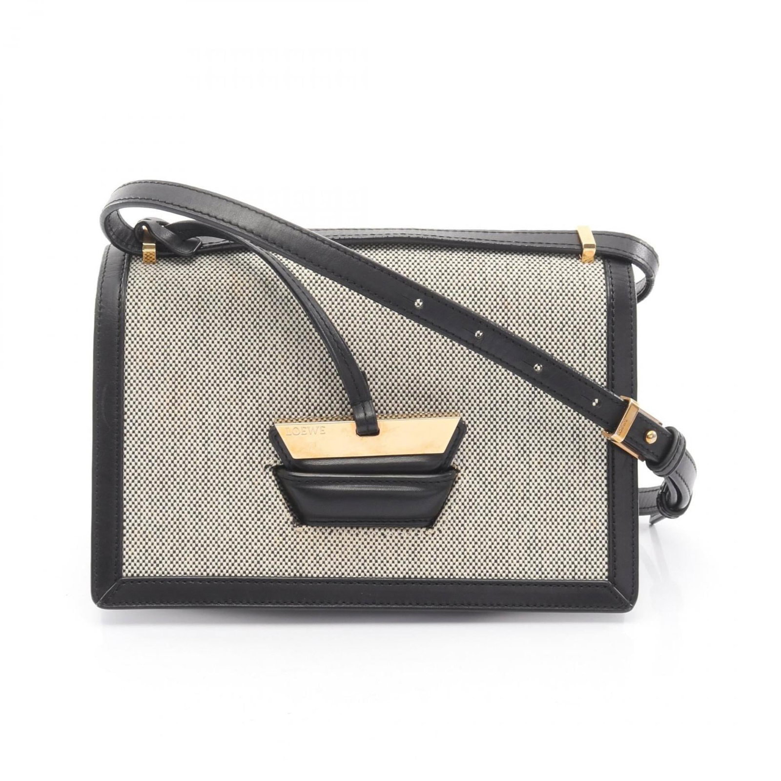 Canvas leather shoulder bag by Loewe: Canvas leather shoulder bag by Loewe Canvas and leather combine in sleek, sophisticated design. The black canvas exterior pairs with luxurious ivory leather accents, while the structured shape and pre