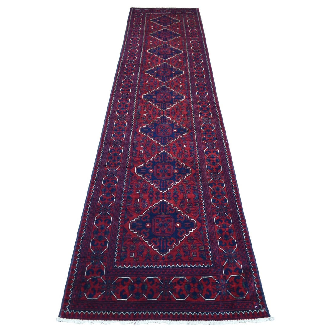 2'7"x13' Deep Red Afghan Khamyab Soft Wool Hand Knotted Runner Rug: 2'7"x13' Deep Red Afghan Khamyab Soft Wool Hand Knotted Runner Rug Deep red hues and intricate patterns come together in this stunning 2'7"x13' deep red Afghan Khamyab soft wool hand-knotted runner ru