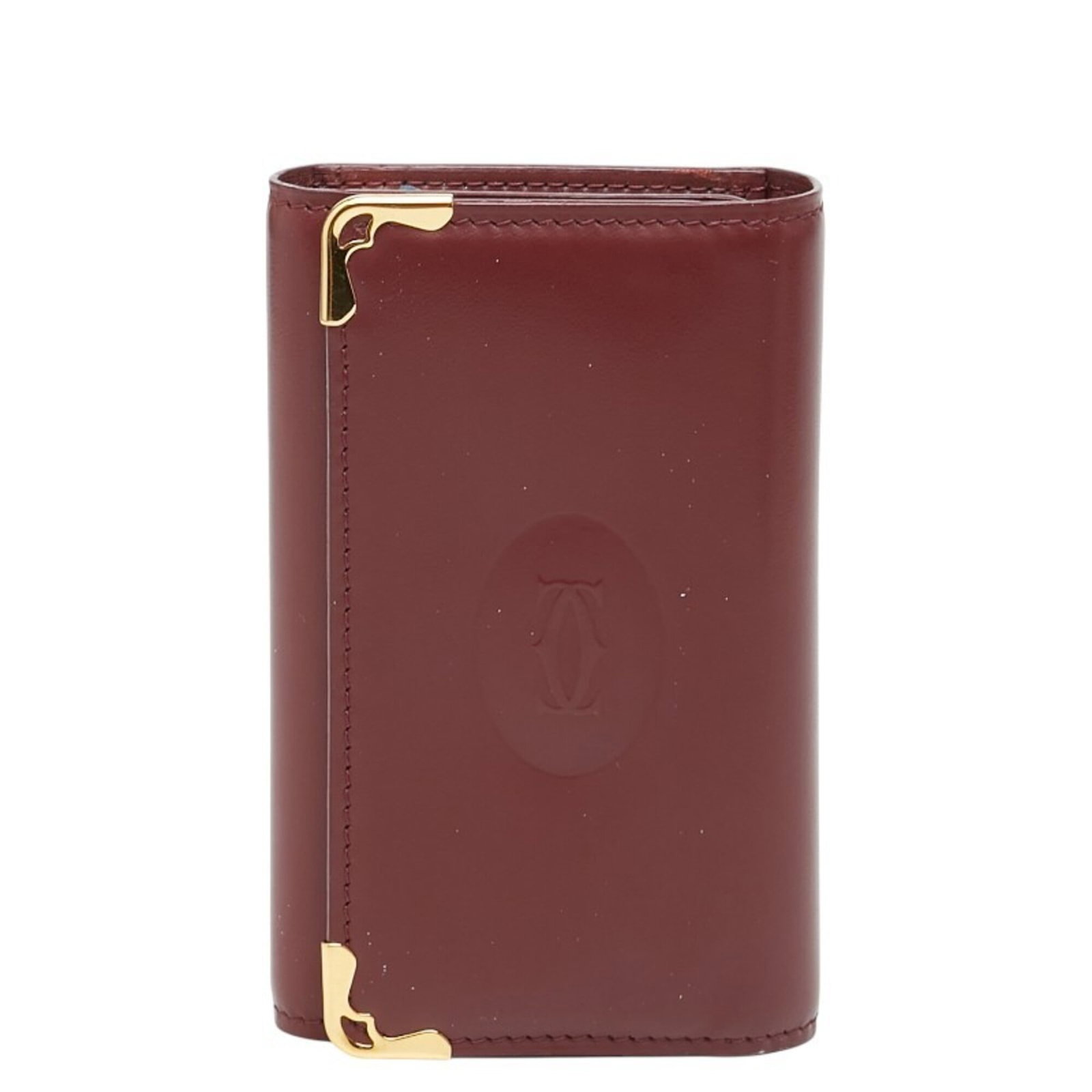 Cartier Keycase Leather: Cartier Keycase Leather Bordeaux, Wine red Cartier Keycase Leather measures 10.5cm x 6.5cm x 1.5cm in size, featuring a classic design with elegant proportions. The item is made from high-quality leat