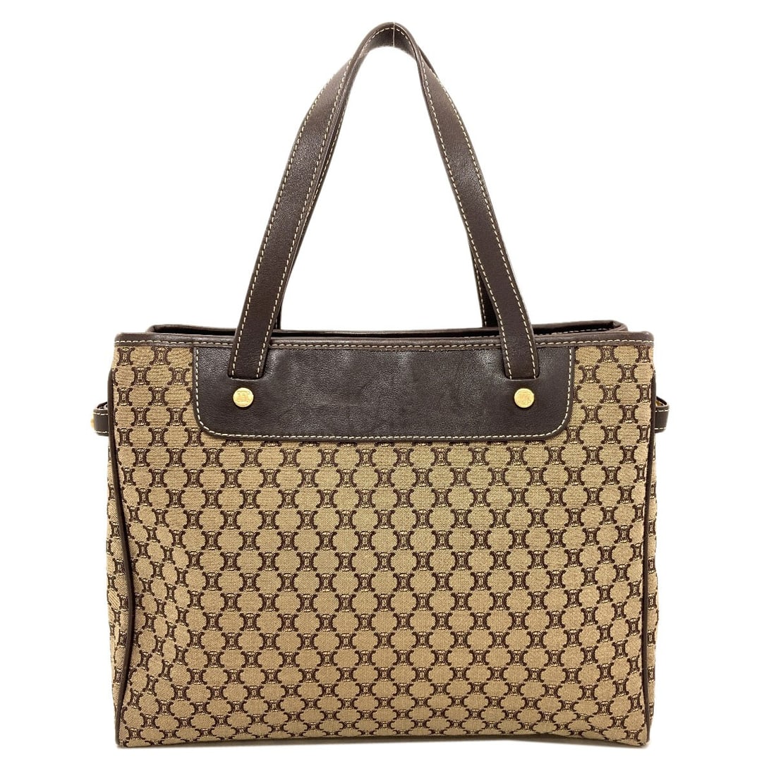 Pattern Handbag Celine Macadam: Pattern Handbag Celine Macadam Brown canvas Celine handbag with a distinctive pattern, bearing a signature. This classic style features a timeless design and a neutral brown exterior color that adds a