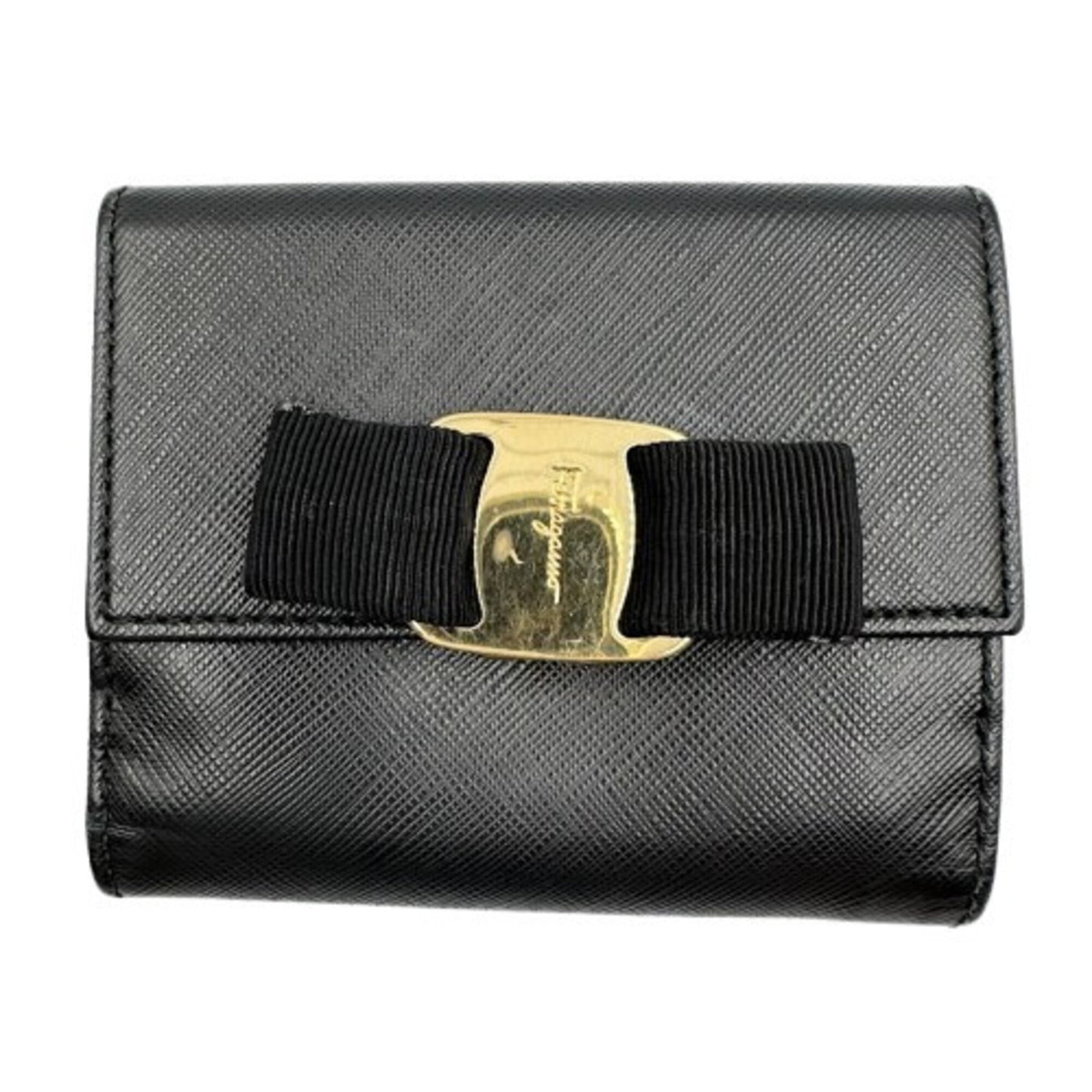 Salvatore Ferragamo Wallet (Bi-Fold) Leather: Salvatore Ferragamo Wallet (Bi-Fold) Leather The Salvatore Ferragamo bi-fold wallet in black leather features a sleek design with clean lines and a classic silhouette. Made from high-quality leather, 