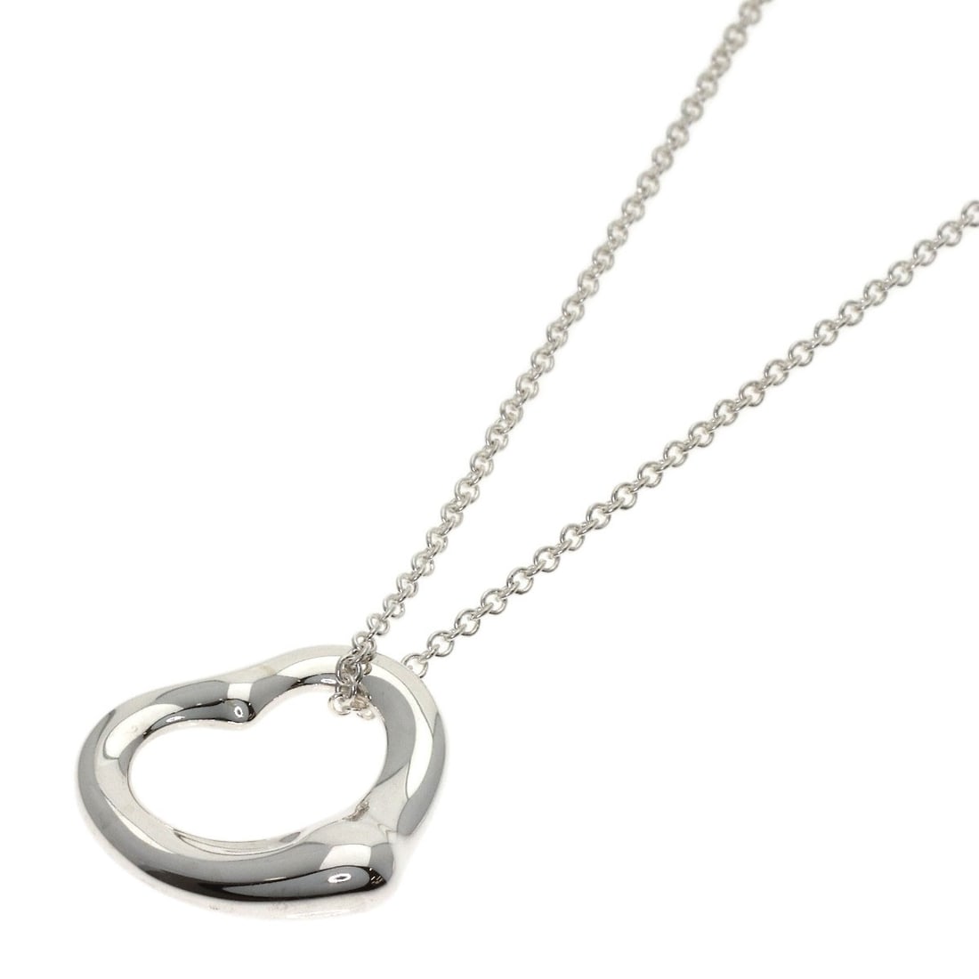 Tiffany Co Open Heart Necklace: Tiffany Co Open Heart Necklace The Tiffany Co Open Heart Necklace boasts its sleek silver design, making it a striking accessory. Measuring 15.7 inches in length, this necklace offers a versatile