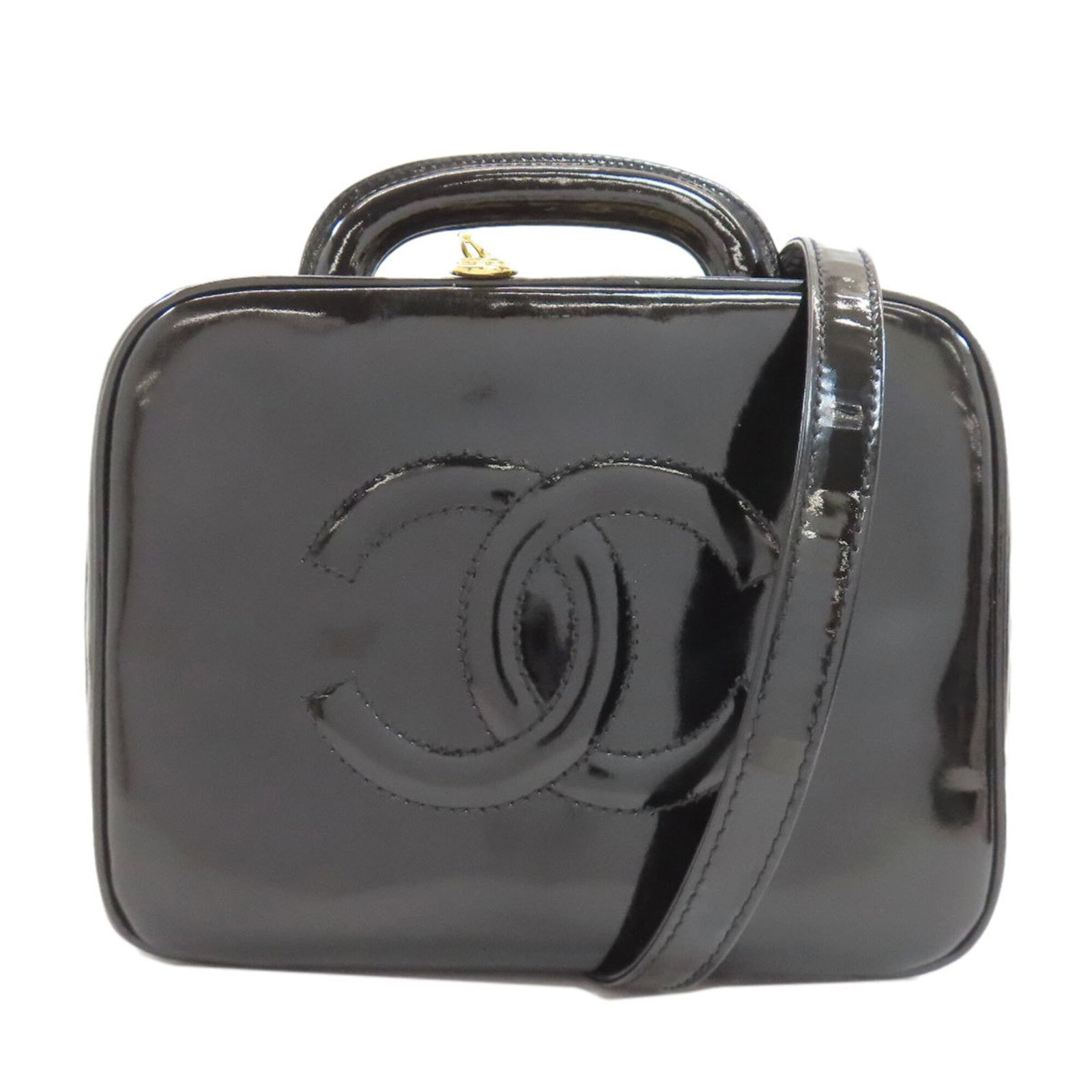 Handbag Patent Leather By Chanel: Handbag Patent Leather By Chanel Patent leather from iconic French fashion house Chanel adorns this sleek black handbag, distinguished by its distinctive zipper closure. Measuring just 15cm x 20cm x 1