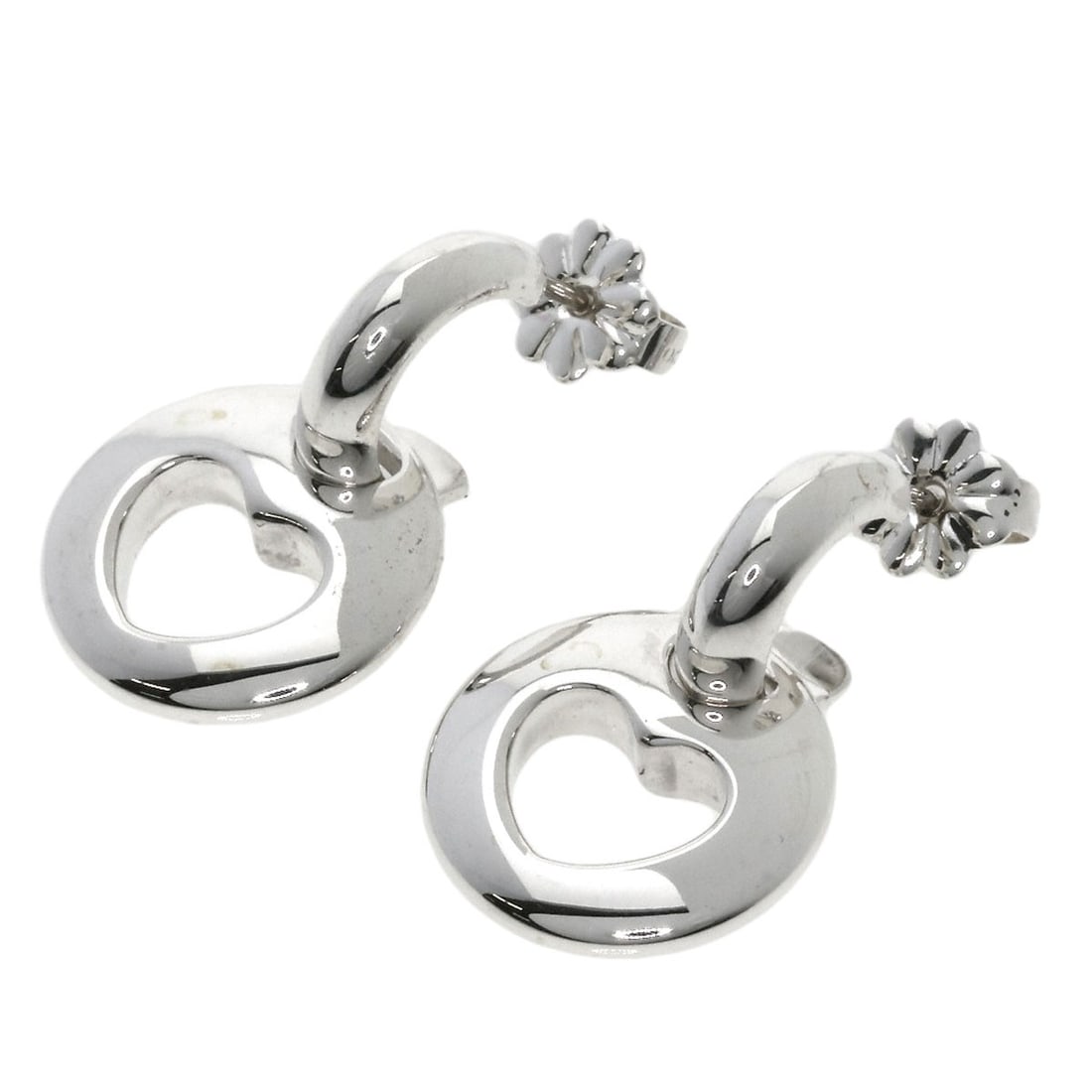 Heart Earring Silver by Tiffany & Co: Heart Earring Silver by Tiffany & Co Silver Heart Earring by Tiffany & Co, featuring a sleek and modern design with no stone. This earring boasts a striking silver finish that adds a touch of