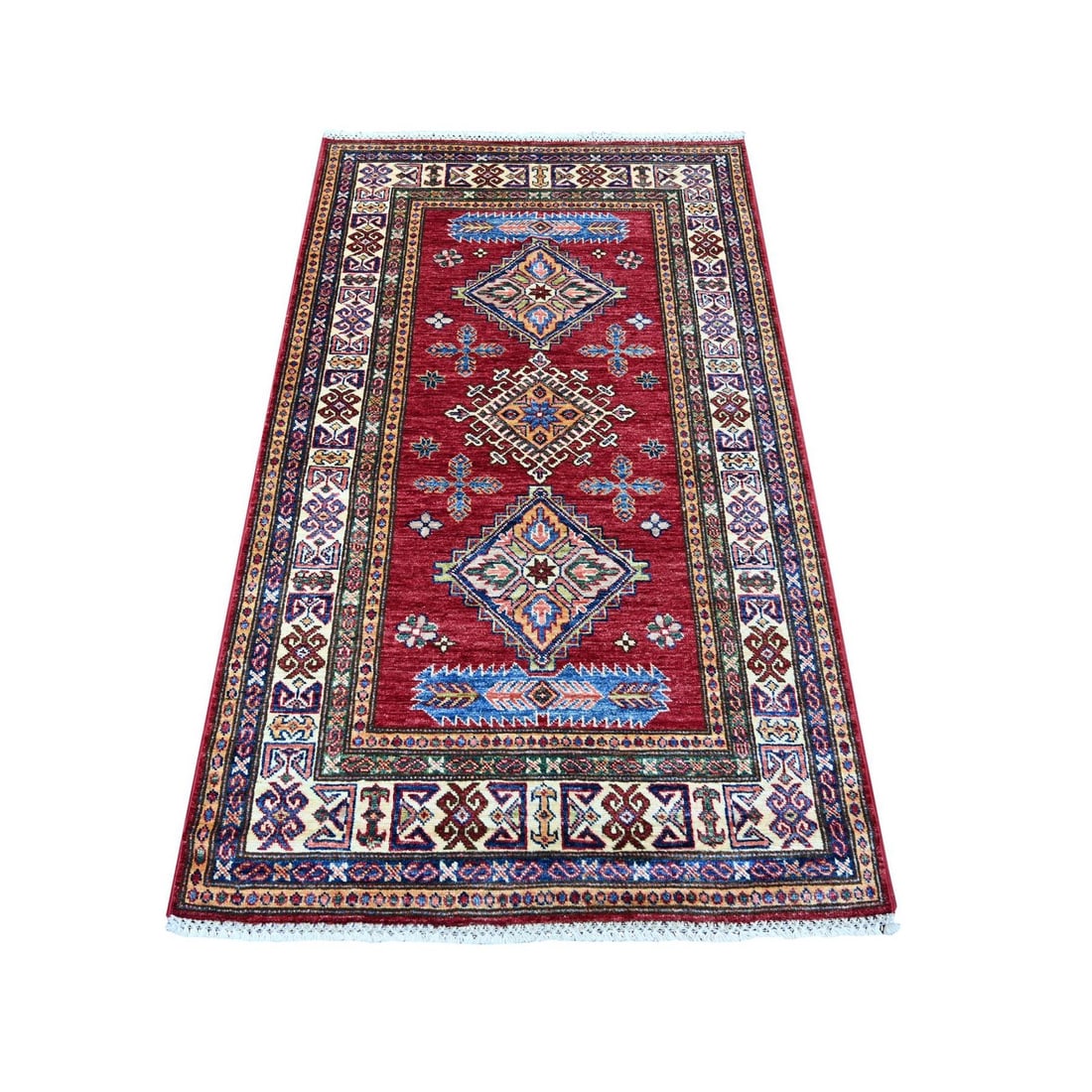 3'4"x5'7" Red Afghan Super Kazak Medallions Design Hand Knotted Wool Rug: 3'4"x5'7" Red Afghan Super Kazak Medallions Design Hand Knotted Wool Rug The Red Afghan Super Kazak Medallions Design Hand Knotted Wool Rug boasts a striking medallion pattern in rich reds, complement