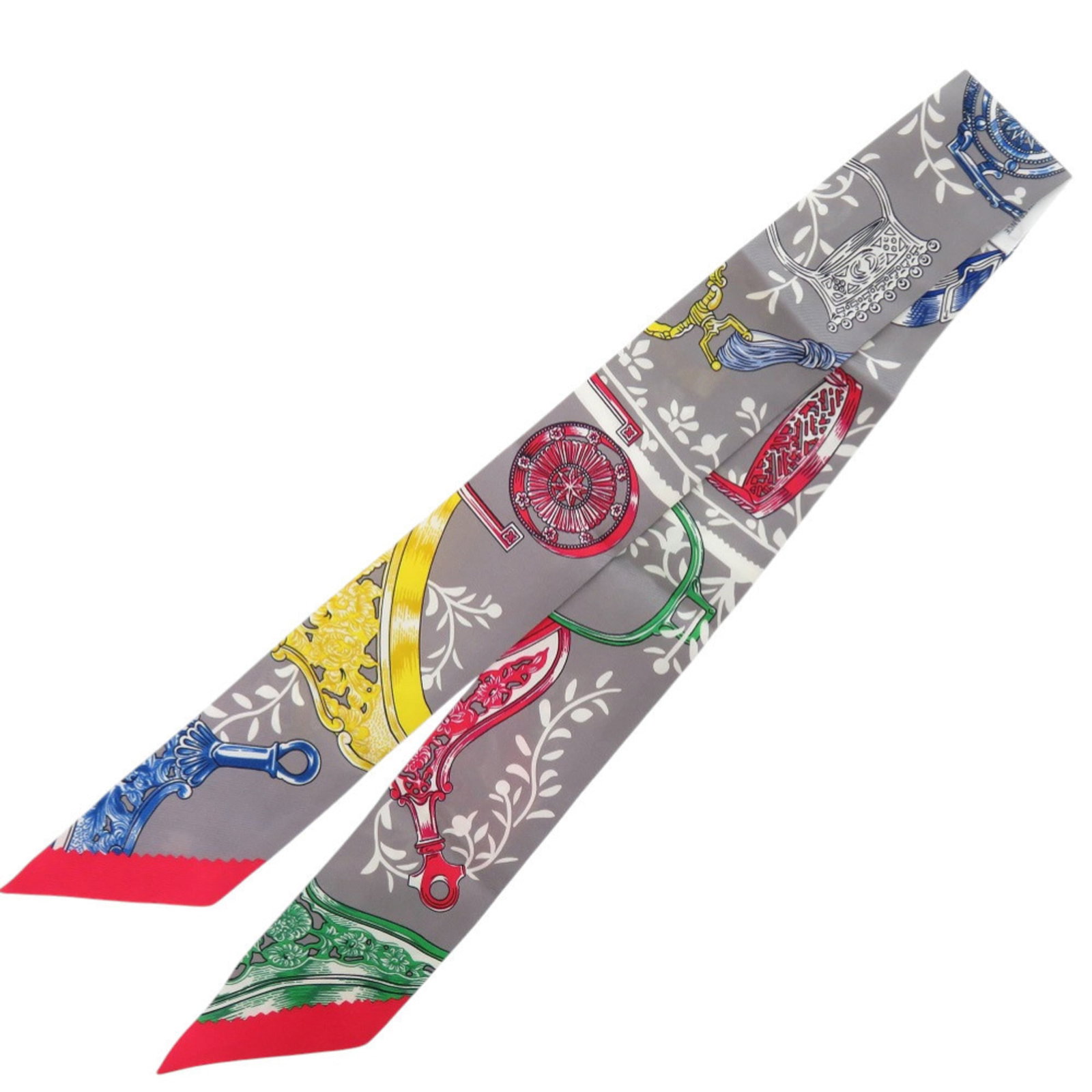 Hermes silk scarf: Hermes silk scarf Silk from France, crafted by Hermes, forms the basis of this Twilly scarf. Measuring 5cm x 85.5cm, it features a signature and is made from high-quality silk material. A stylish acce