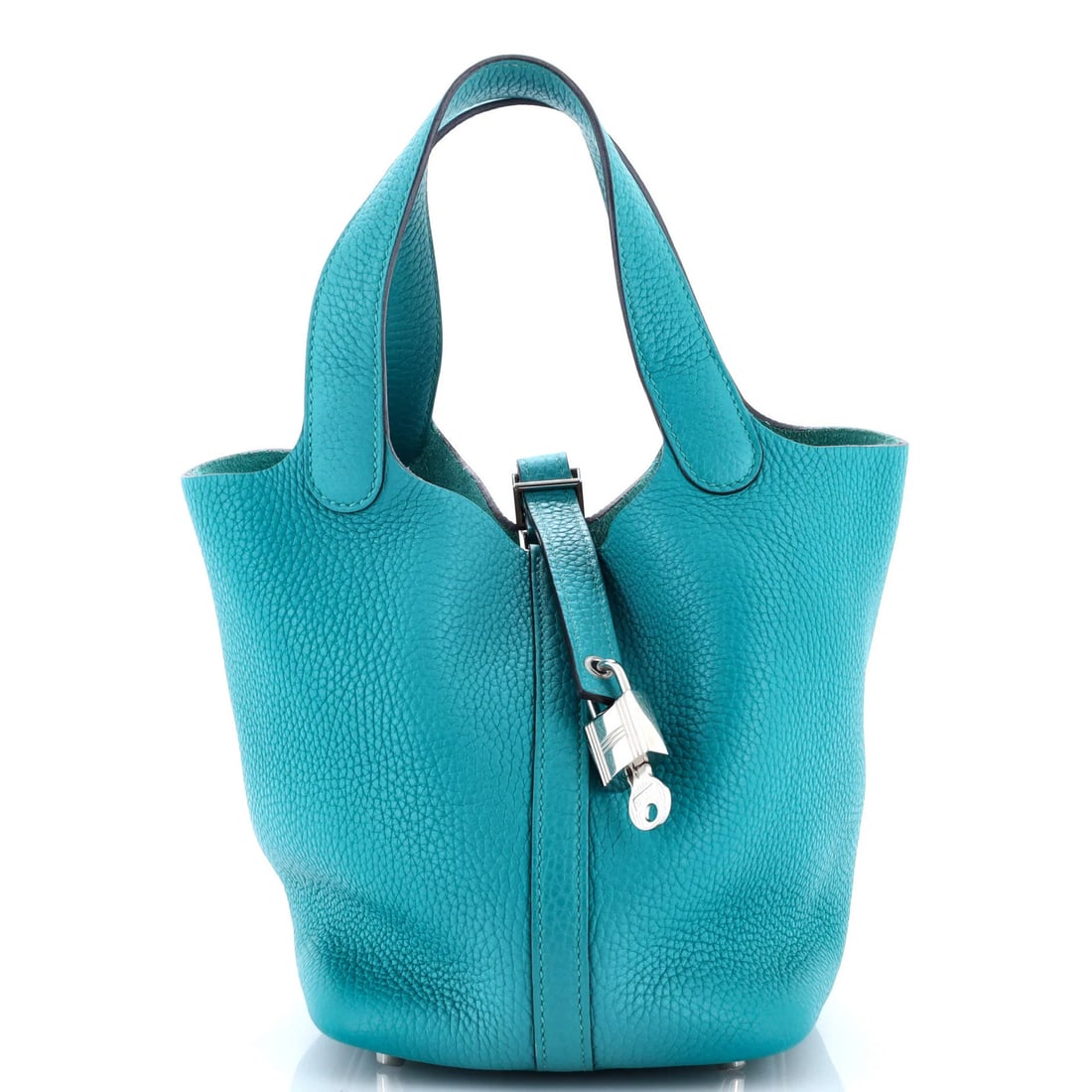 Hermes Picotin Lock Bag Clemence PM: Hermes Picotin Lock Bag Clemence PM The Hermes Picotin Lock Bag Clemence PM boasts sleek, blue leather exterior with palladium hardware, exuding understated sophistication. This versatile bucket bag f