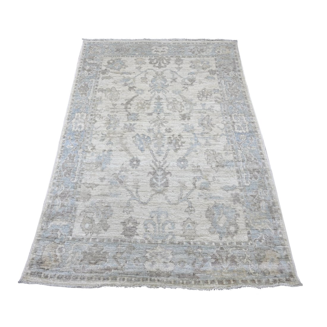 Afghan Angora Hand knotted Oushak ivory wool rug all over design: Afghan Angora Hand knotted Oushak ivory wool rug all over design Hand-knotted in wool, this stunning Oushak rug boasts an all-over floral design in ivory and brown hues, set against a light gray borde