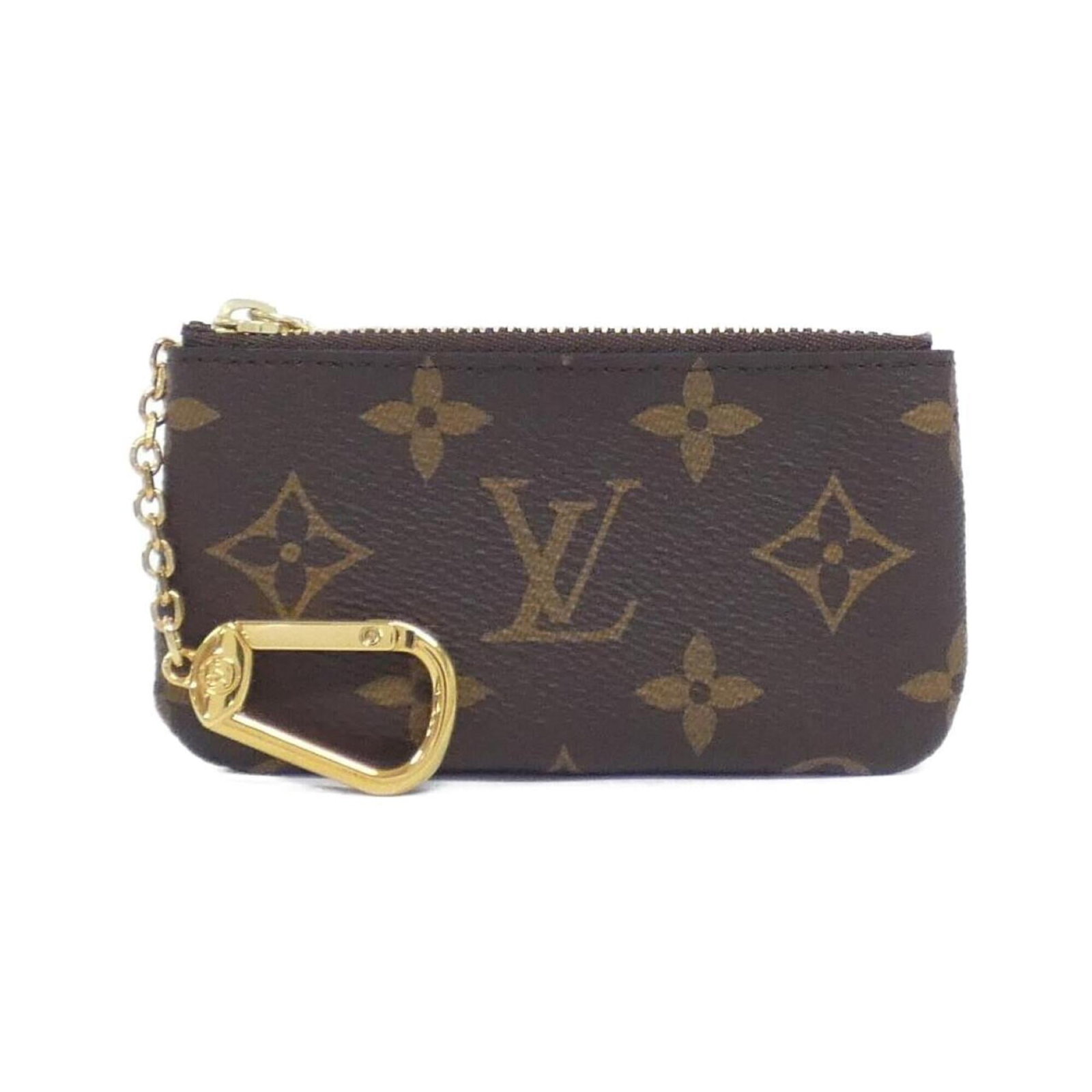 Louis Vuitton Coin Purse/ Coin Case Coated Canvas: Louis Vuitton Coin Purse/ Coin Case Coated Canvas Coated canvas craftsmanship meets timeless design in this Louis Vuitton coin purse, featuring a classic marron hue and sleek dimensions. With its comp