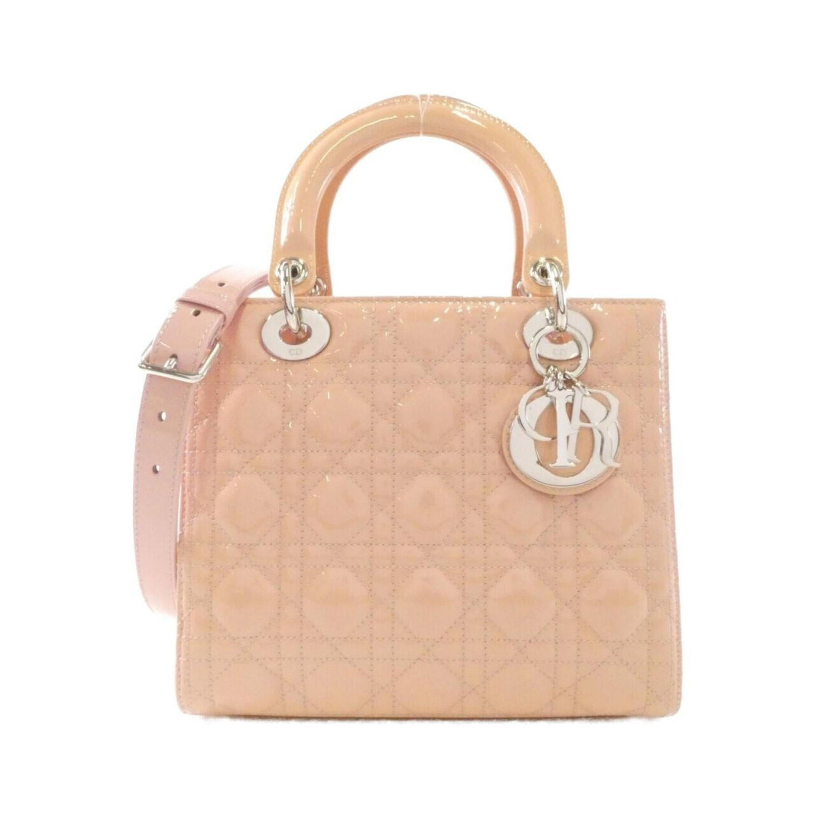 Handbag Christian Dior Leather: Handbag Christian Dior Leather The Christian Dior leather handbag boasts a sleek, beige-pink color and elegant design. Made from high-quality leather, it features an enamel finish that adds a touch of