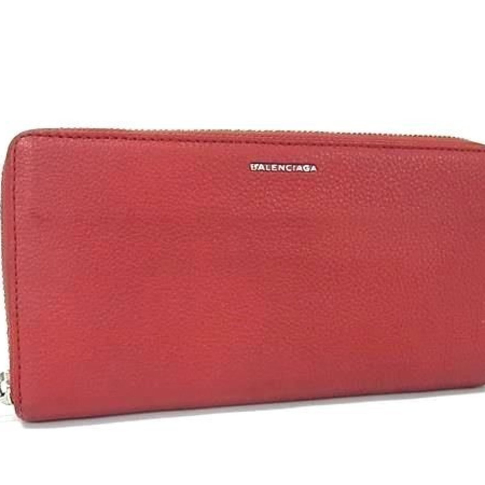 Long Bi Fold Leather Wallet: Long Bi Fold Leather Wallet Red leather long bi-fold wallet with zipper closure, measuring 10cm x 19cm x 2cm. This Italian-made wallet features a bold red color and classic design. Made from