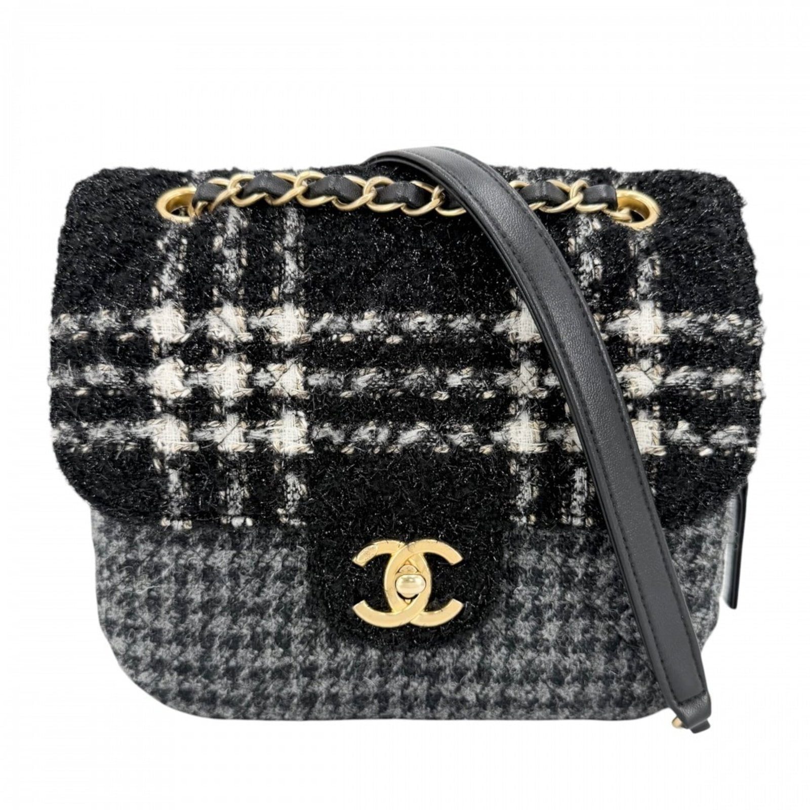 Wool Tweed Shoulder Bag: Wool Tweed Shoulder Bag This black and gray wool tweed shoulder bag features a timeless design with clean lines and classic proportions. Made from high-quality tweed and wool materials, it boasts a lu
