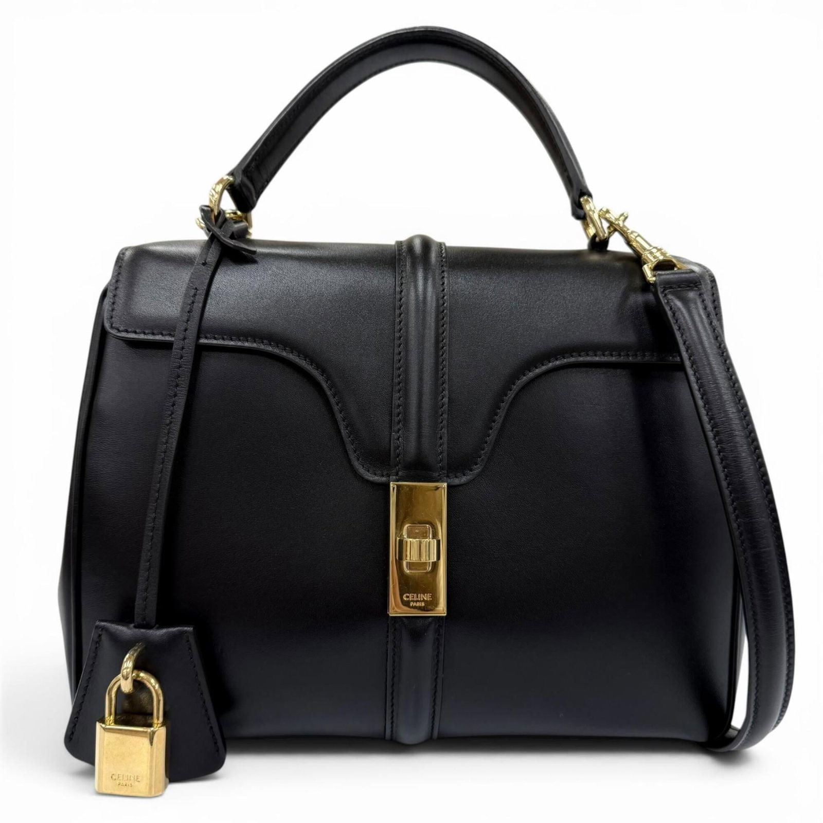 Celine Handbag Shoulder Bag Leather: Celine Handbag Shoulder Bag Leather Calfskin leather construction provides durability and sophistication to this sleek black shoulder bag from Celine. Measuring 18cm x 23cm x 10cm, the bag's compact s