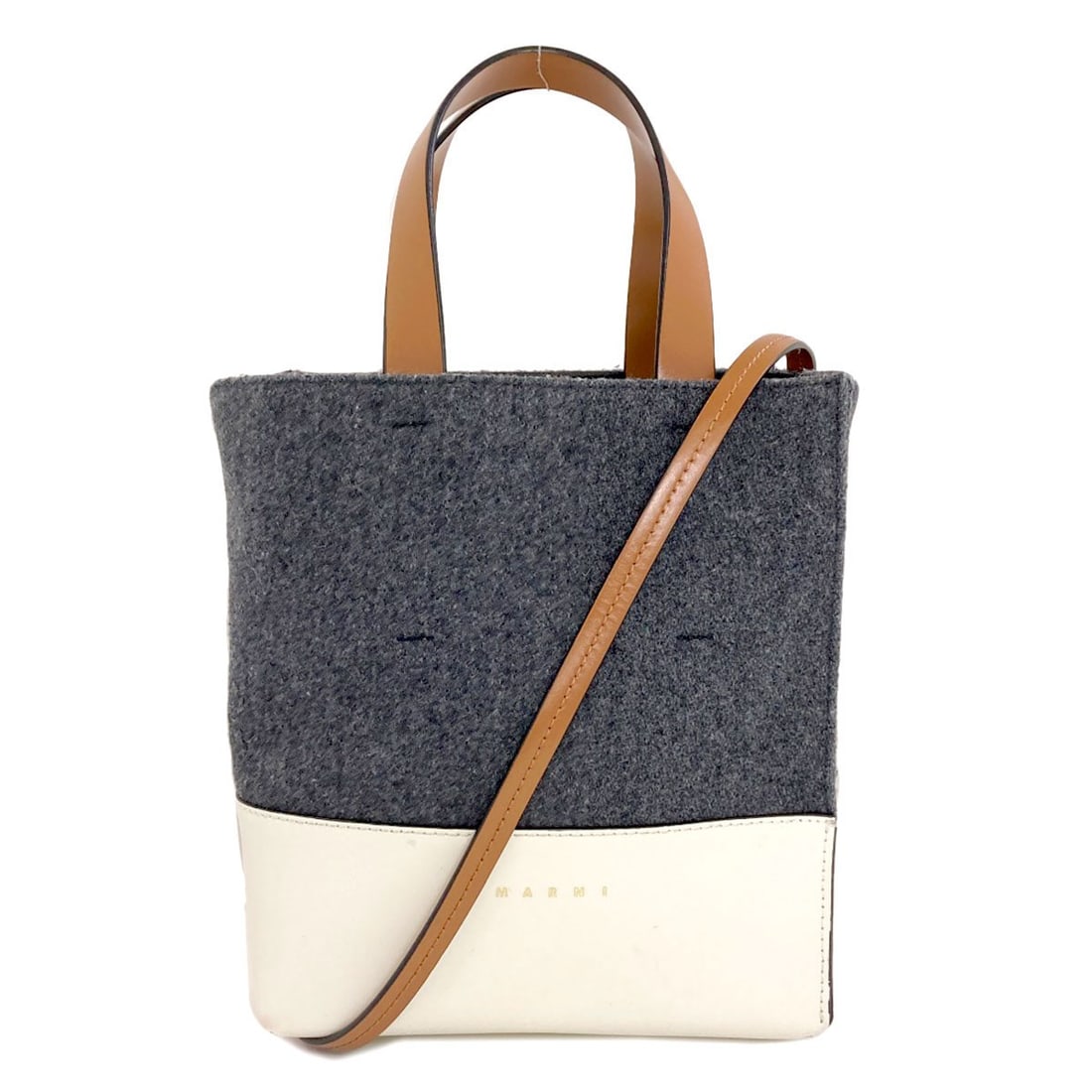 Marni 2Way Handbag Felt Leather: Marni 2Way Handbag Felt Leather Marni's 2Way Handbag features a striking gray felt leather exterior, showcasing the brand's unique style. The bag's design allows for versatility, with its two-way func