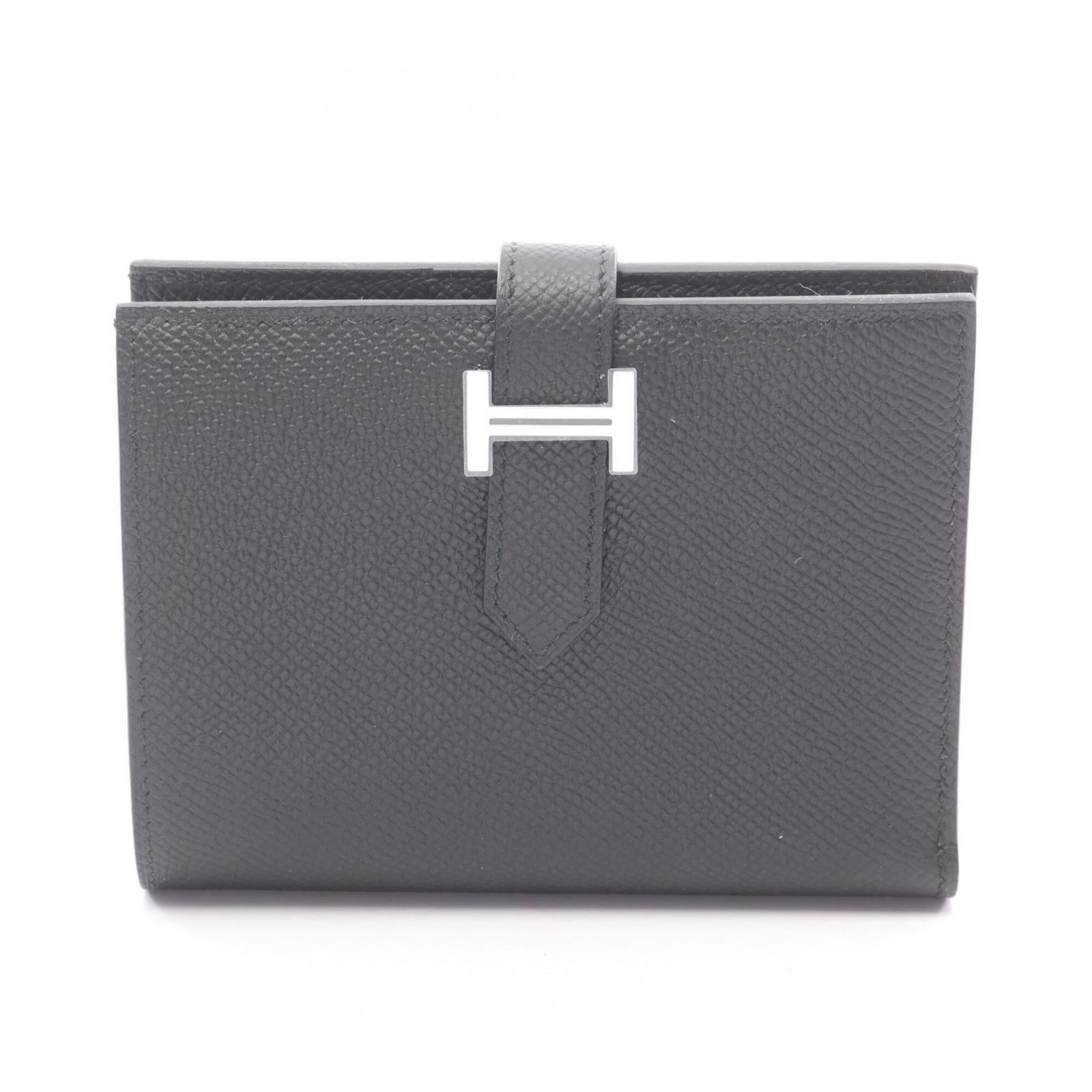 Epsom Leather Bi Fold Wallet Hermes: Epsom Leather Bi Fold Wallet Hermes Epsom leather, a luxurious material choice, adorns the Epsom Leather Bi Fold Wallet Hermes. This black bi-fold wallet measures 9cm x 12cm x 2cm and features a sleek
