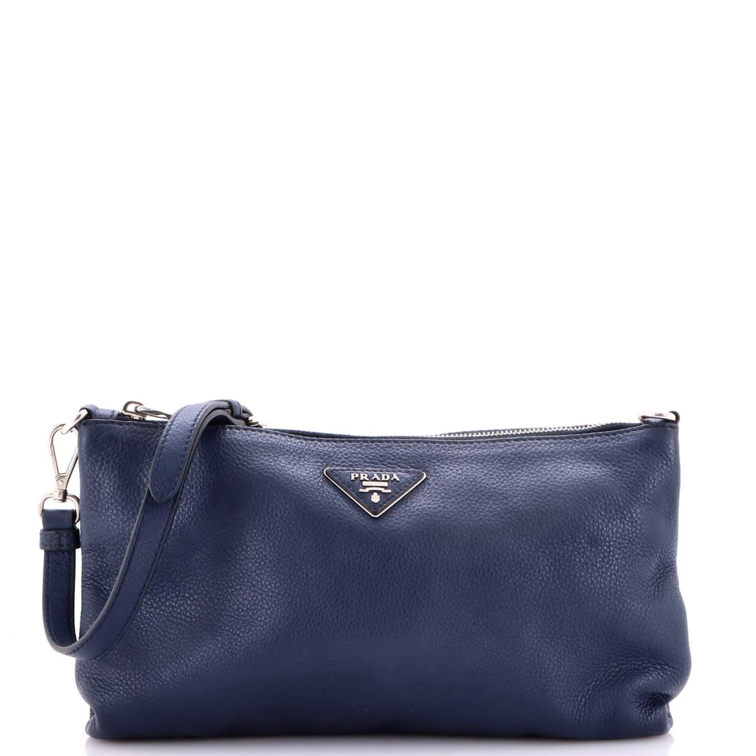 Prada Flat Zip Crossbody Bag Vitello Daino Mini: Prada Flat Zip Crossbody Bag Vitello Daino Mini The Prada Flat Zip Crossbody Bag Vitello Daino Mini boasts a sleek, blue leather exterior and a spacious interior with a light blue fabric lining. Measu