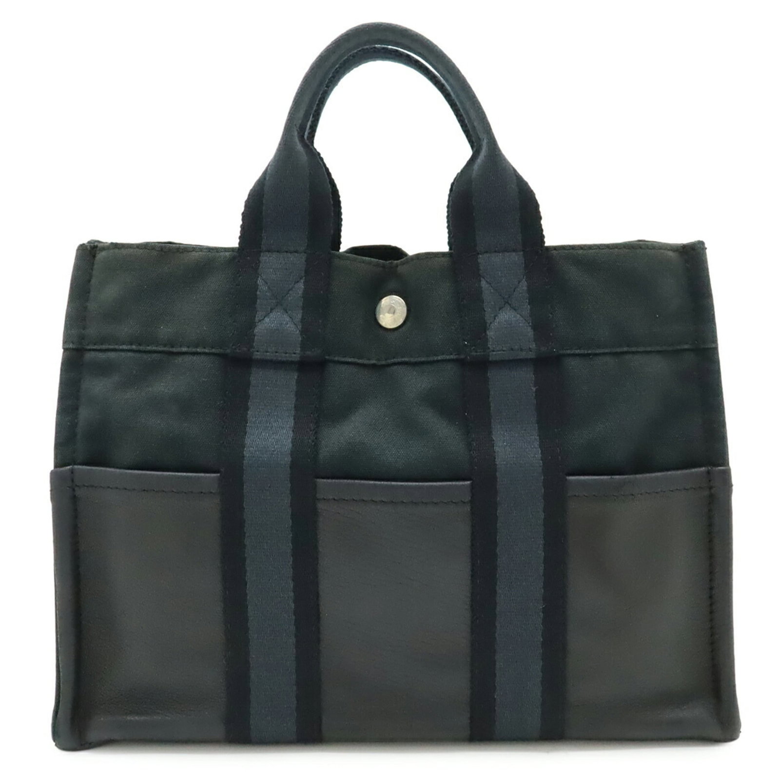 Canvas Leather Handbag Tote Hermes: Canvas Leather Handbag Tote Hermes Canvas Leather Handbag Tote from Hermes, featuring a classic design with canvas and leather construction. Measuring 22cm x 30.5cm x 8.5cm, this tote bag weighs 450g