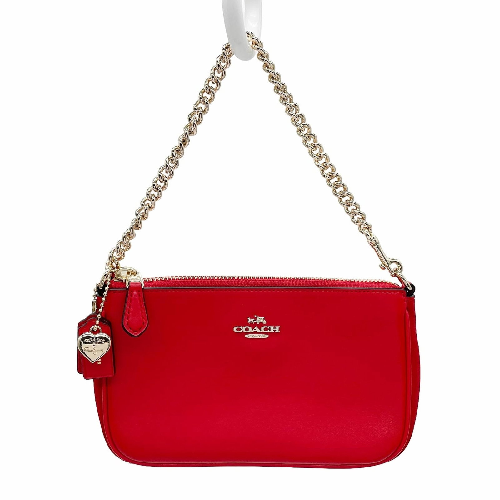 Handbag Leather Coach: Handbag Leather Coach Red leather handbag from Coach, measuring 11cm x 19cm x 5cm. Features a classic design with a 30cm long handle, perfect for everyday use. Made from high-quality leather, this
