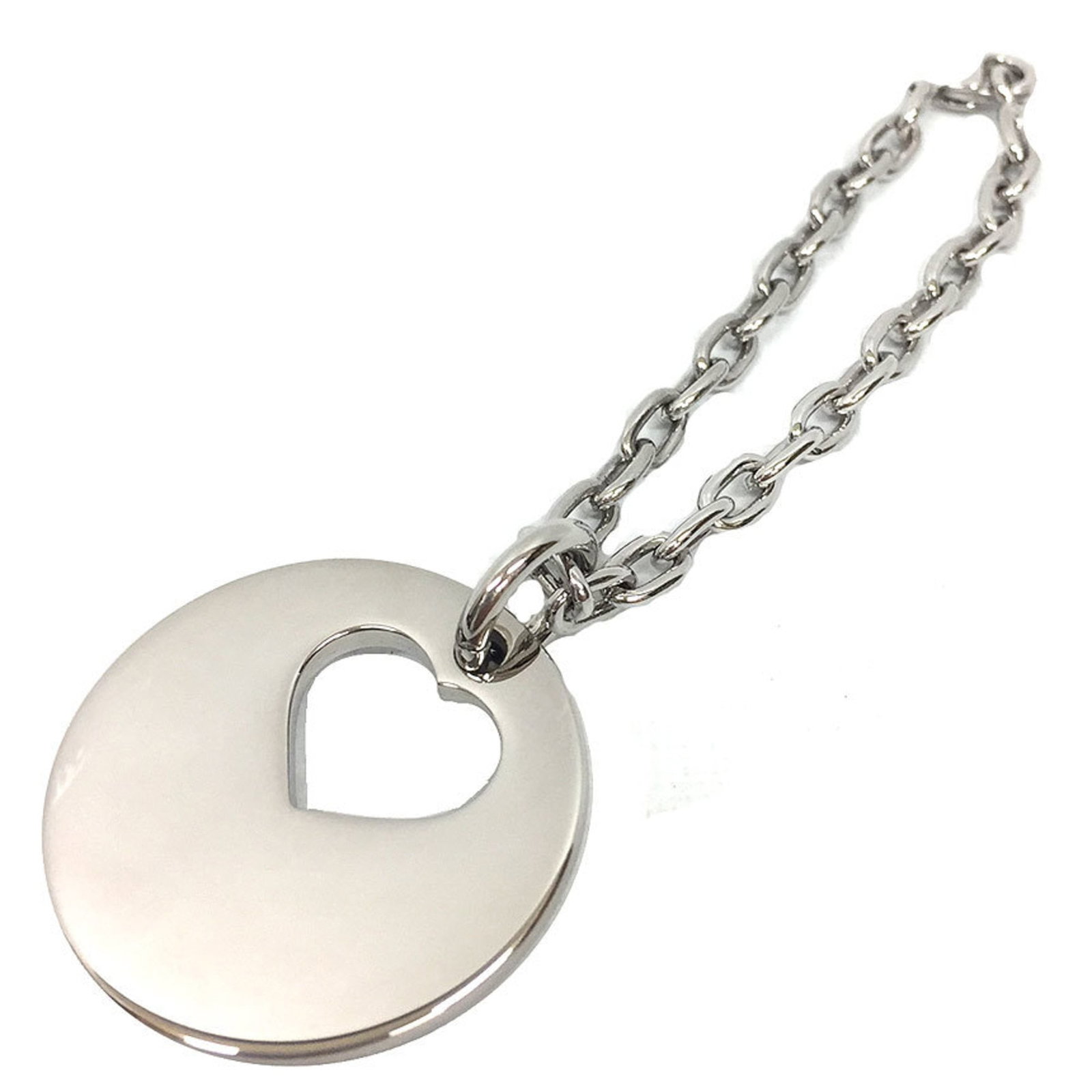 Keyring from Cartier: Keyring from Cartier Silver Cartier keyring, presented in a box. The keyring itself is made from metal and features the iconic Cartier brand. A simple yet elegant accessory for everyday use. Item Spec