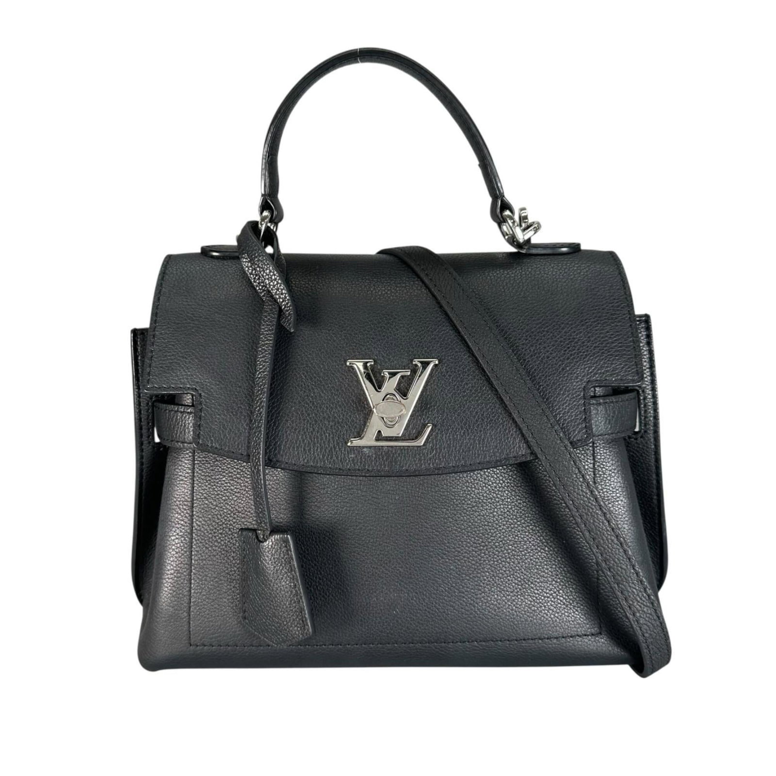 Handbag Louis Vuitton Leather: Handbag Louis Vuitton Leather Navy blue leather Louis Vuitton handbag with silver hardware, measuring 20cm x 29cm x 10cm. This classic design features high-quality craftsmanship and timeless