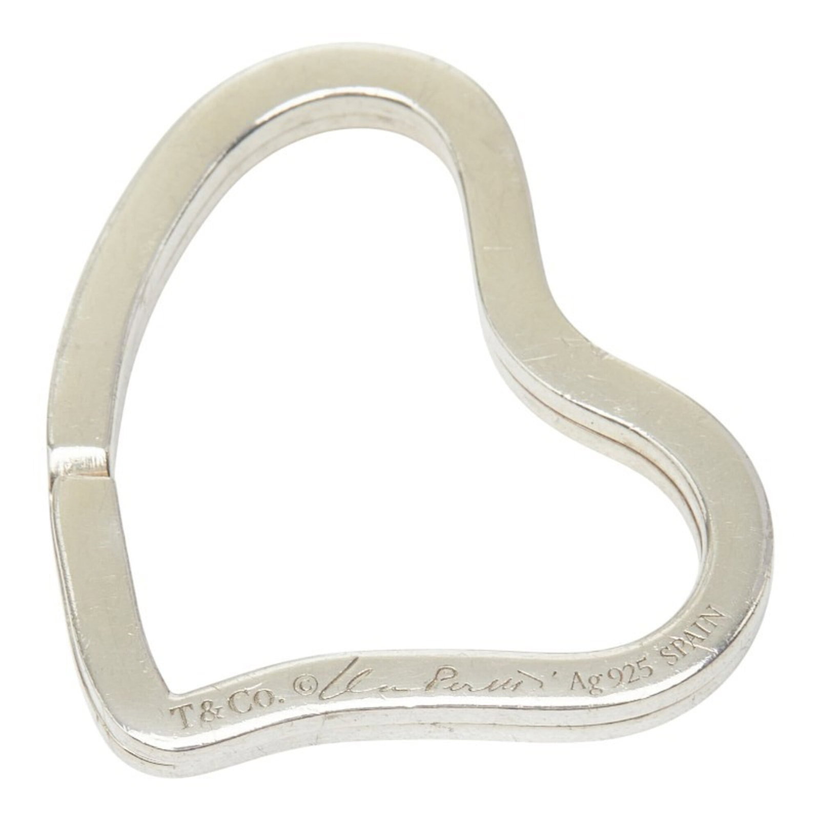 Keyring Silver Tiffany 925: Keyring Silver Tiffany 925 Silver Keyring from the Tiffany Line, crafted with 925 sterling silver for durability and shine. This elegant keyring measures 2.87cm x 3.59cm and features a sleek design th