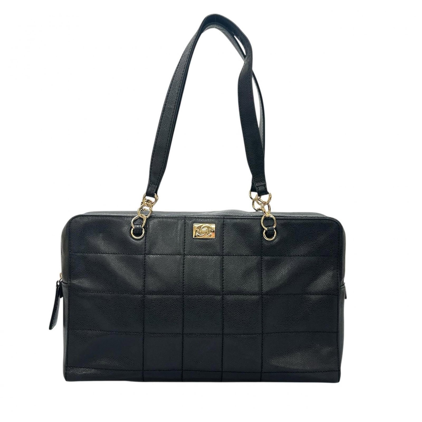 Leather tote bag by Chanel: Leather tote bag by Chanel Black leather tote bag by Chanel, measuring 25cm x 43cm x 8cm. This Italian-made tote features high-quality leather construction and a classic design that exudes timeless el