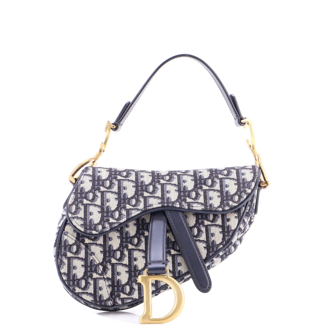 Canvas mini handbag saddle Oblique Christian Dior: Canvas mini handbag saddle Oblique Christian Dior Canvas mini handbag saddle Oblique Christian Dior features a striking blue canvas exterior with neutral interior, adorned with aged gold hardware. The