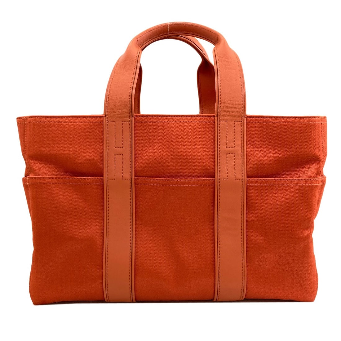 Cotton Polyester Akapu Luco Tote Bag By Hermes: Cotton Polyester Akapu Luco Tote Bag By Hermes Cotton Polyester Akapu Luco Tote Bag By Hermes - A vibrant orange tote bag made from cotton and polyester, bearing the iconic style of Herm?s. This uniqu