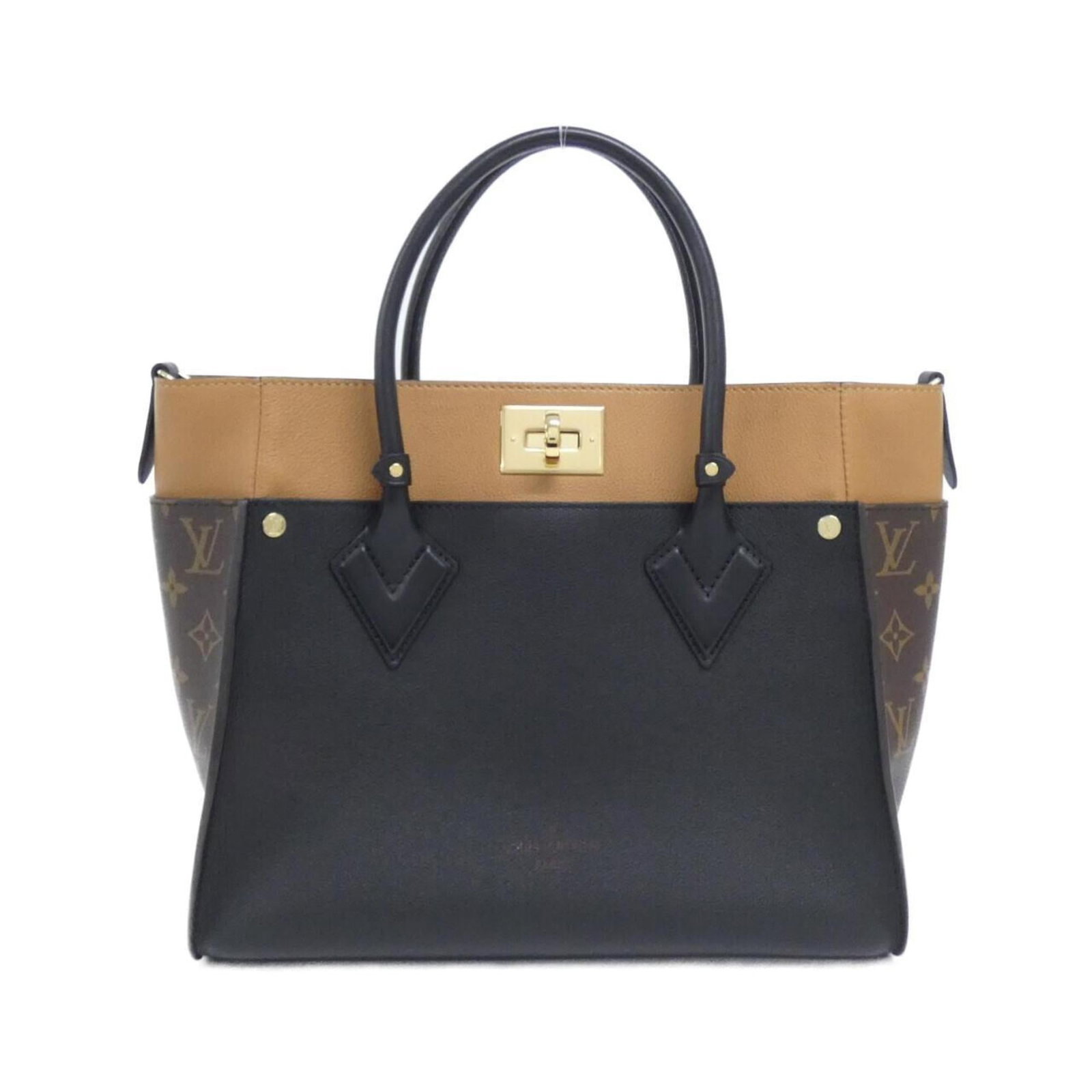 Coated Leather Canvas Handbag Louis: Coated Leather Canvas Handbag Louis Black Coated Leather Canvas Handbag with Gold Hardware. Made from high-quality calf leather and coated canvas, this Louis Vuitton handbag boasts a sleek design and 